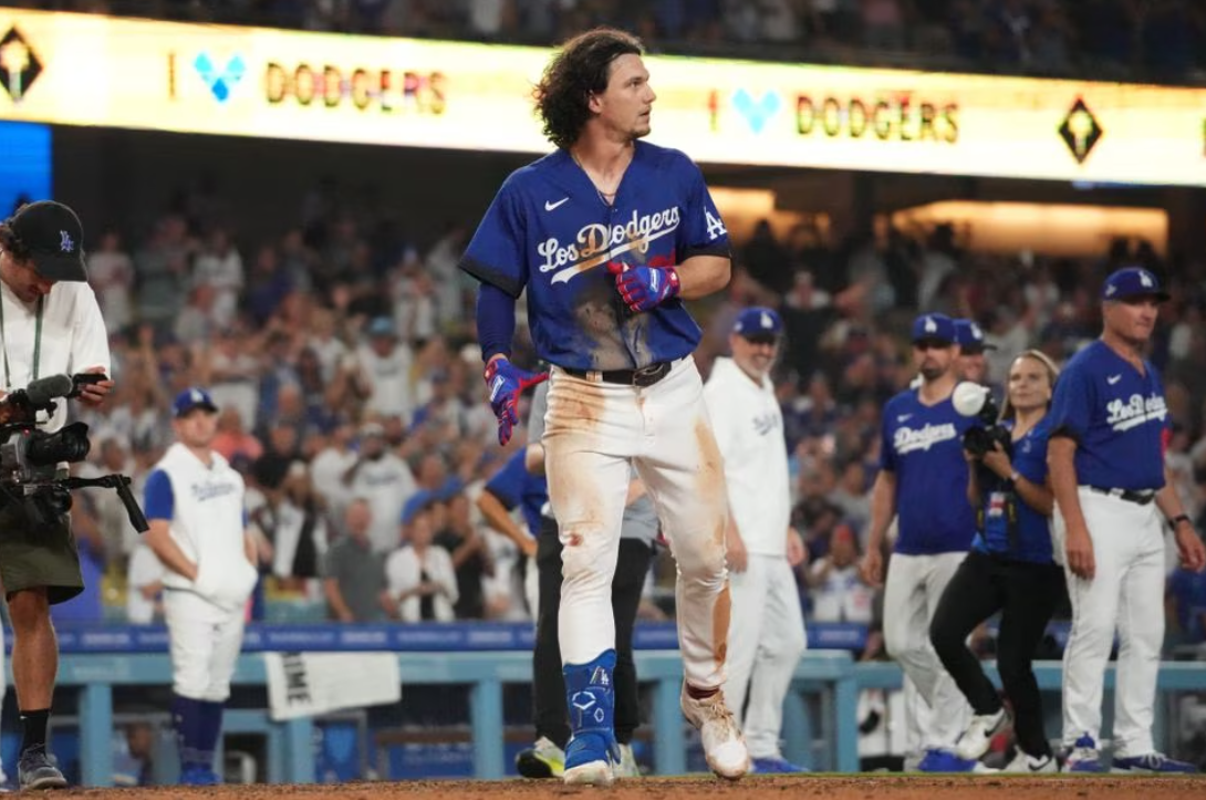 Los Angeles Dodgers center fielder James Outman (33) celebrates after hitting a walk-off double in the 10th inning against the Toronto Blue Jays at Dodger Stadium in Los Angeles, California, July 25, 2023.