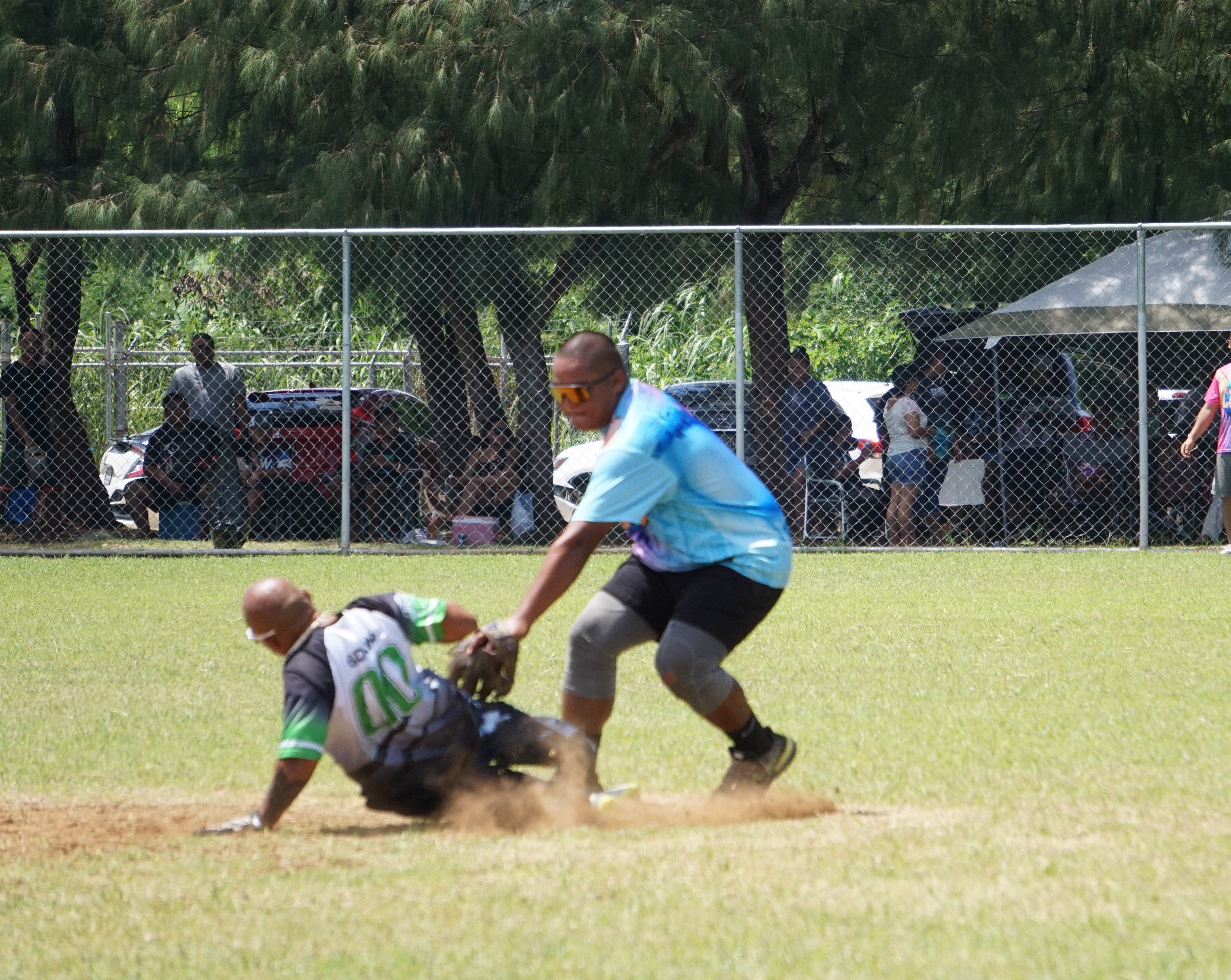 No Excuse second baseman Jerome Delos Santos tags out a runner during the opening game of the 2023 Budweiser Belau Amateur Softball Association Open League Sunday at the Dandan Baseball Field.