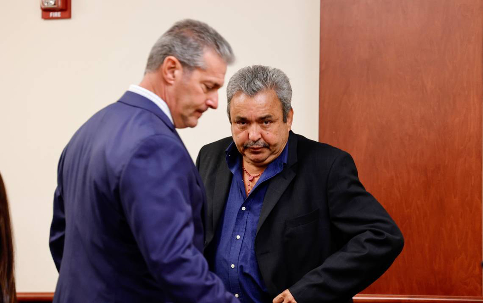 Attorney Eric Bland speaks with Greg Leon, right, in a Lexington County courtroom on Monday, July 18, 2022. (Tracy Glantz/The State/TNS)