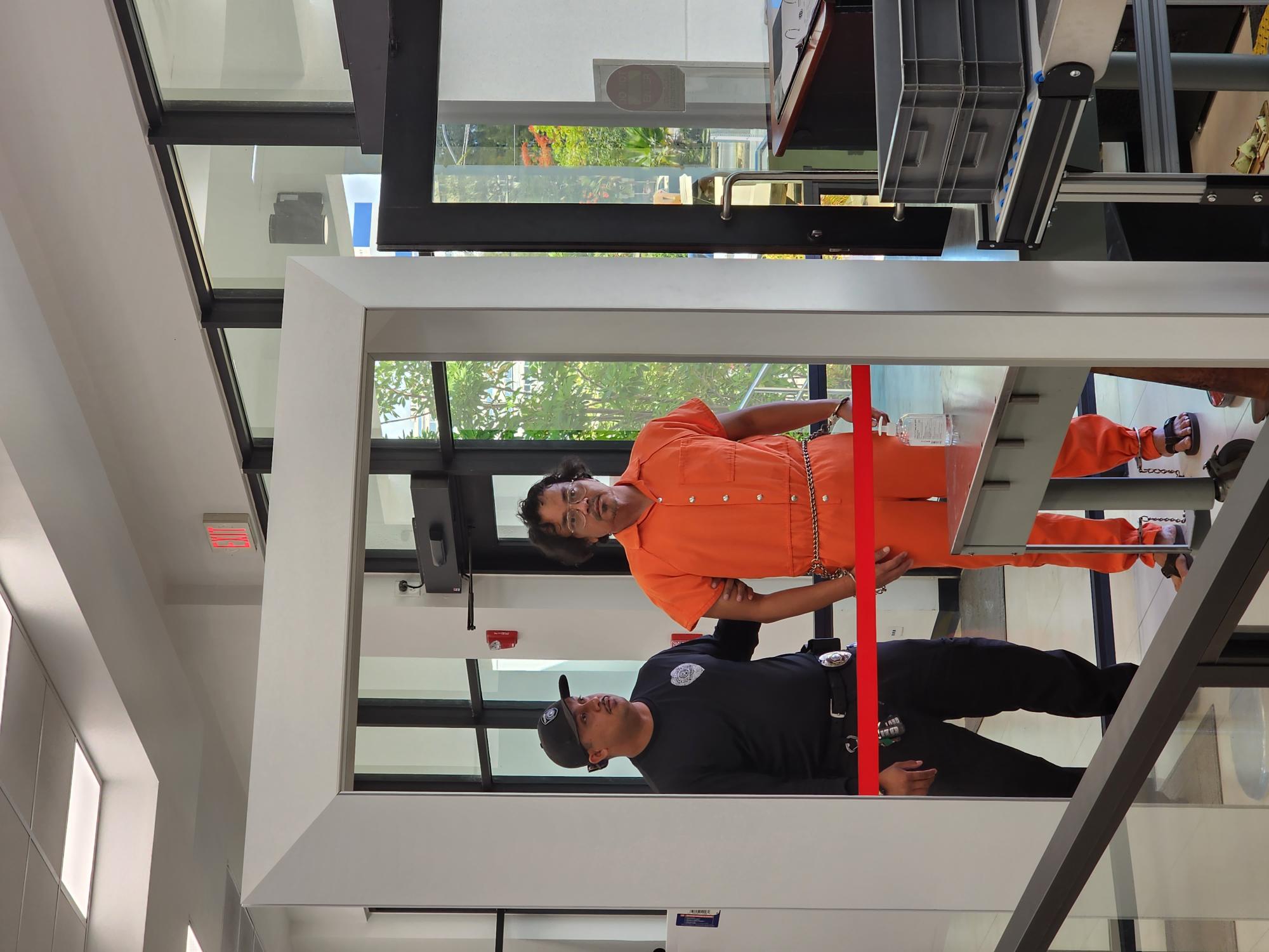 Rufino B. Pangilinan, right, and a Corrections officer enter the local courthouse on Friday morning.