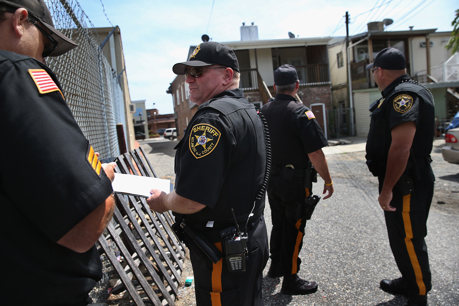 Atlantic County Sheriff's office deputies prepare to evict tennants during foreclosure proceedings in Pleasantville, Atlantic County, New Jersey. (John Moore/Getty Images/TNS)