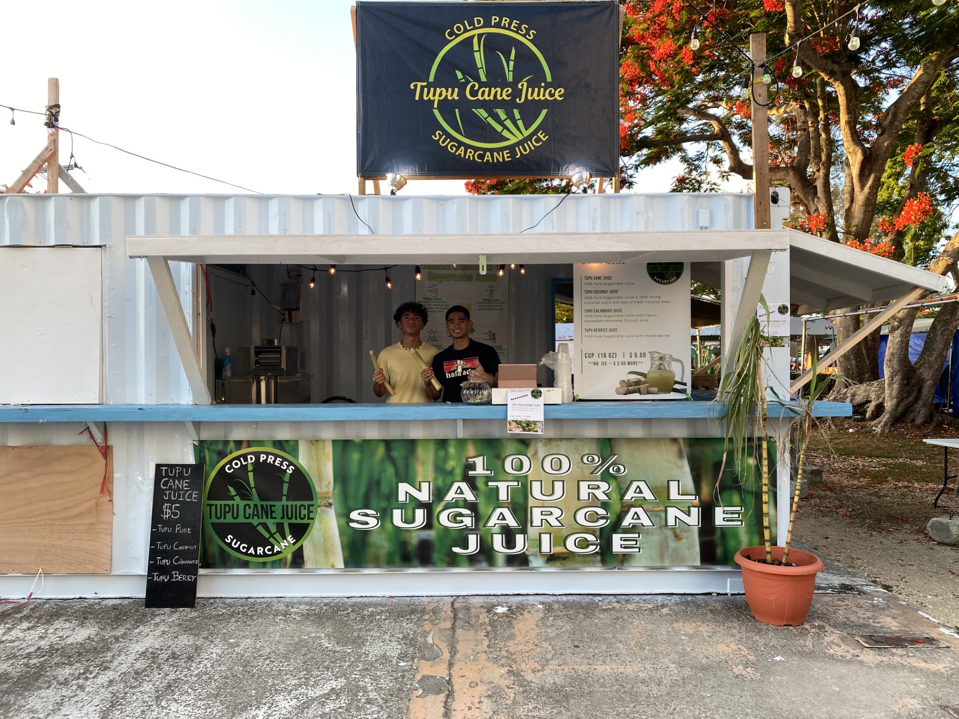 Lincoln Manibusan, left, and Cameron Atalig at the Tupu Cane Juice booth.