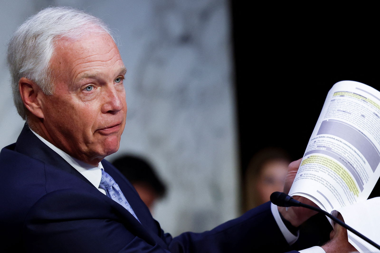 U.S. Senator Ron Johnson (R-WI) holds up redacted documents about 9/11 during a Senate Homeland Security and Governmental Affairs Committee hearing on Capitol Hill to examine the planned PGA Tour-LIV Golf merger, in Washington, U.S., July 11, 2023. REUTERS/Evelyn Hockstein
