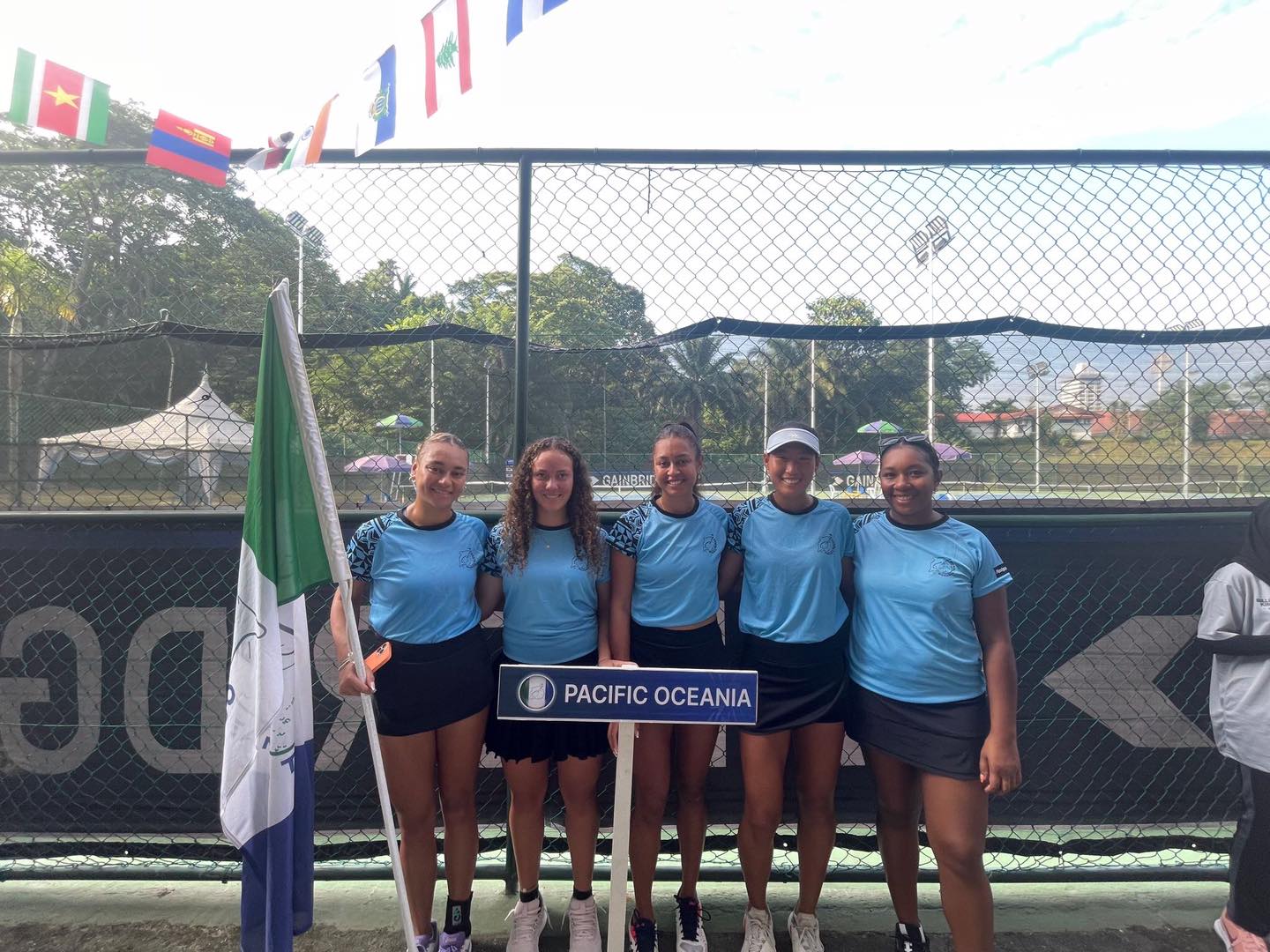 Carol Lee and the other members of the Pacific Oceania team pose for a photo before competing in the Asia/Oceania Group II of the Billie Jean King Cup by Gainbridge in Kuala Lumpur, Malaysia.