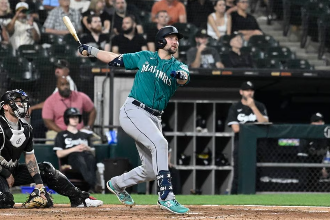 Seattle Mariners catcher Cal Raleigh (29) hits a three run home run against the Chicago White Sox during the eighth inning at Guaranteed Rate Field in Chicago, Illinois, Aug. 21, 2023.