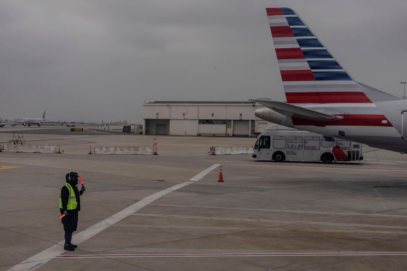 An American Airlines worker is seen at the Los Angeles international airport in Los Angeles, California, U.S., October 31, 2021. REUTERS/Carlos Barria/File Photo