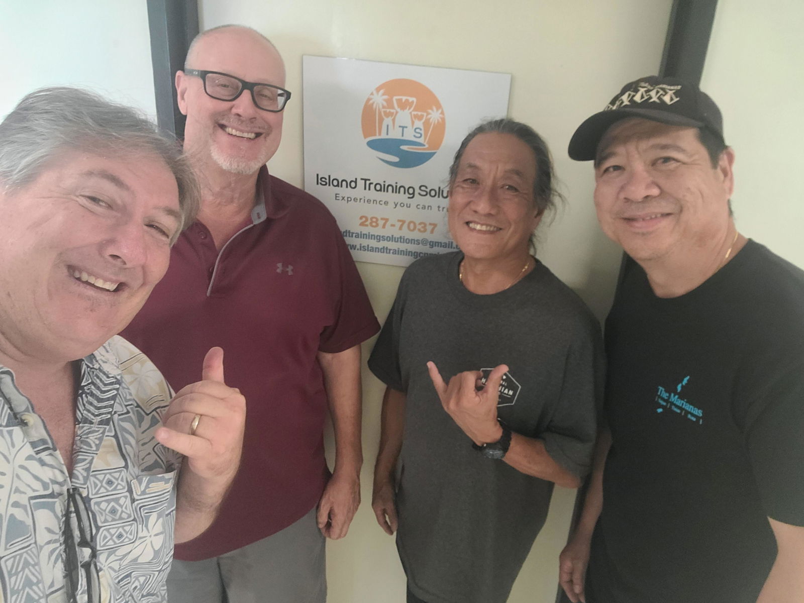 Island Training Solutions owner Jim Arenovski, second right, receives a courtesy call from officers of the Marianas Tourism Education Council at his office in Susupe, Saipan, in appreciation for the $5,000 cash hole-in-one prize sponsored by ITS for the Marianas Tourism Golf Classic on Sept. 2, 2023, at LaoLao Bay Golf & Resort.  From left, MTEC Vice Chairman Glenn Policare, Arenovski, MTEC Board Member Larry Lee, and MTEC Secretary and Marianas Tourism Golf Classic Committee Chairman Martin Duenas.