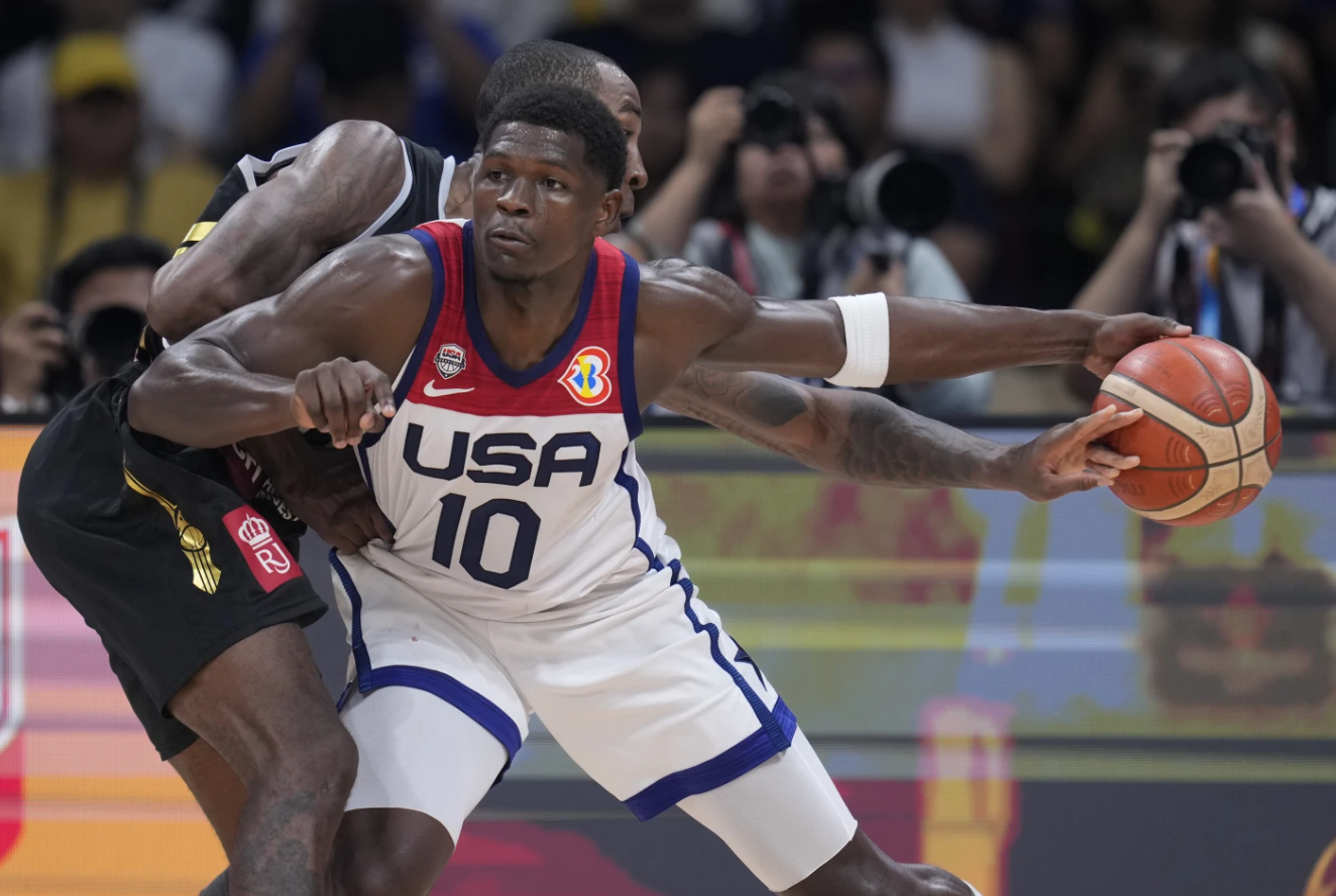 Jordan forward Rondae Hollis Jefferson (24) goes over the top of U.S. guard Anthony Edwards (10) during the first half of a Basketball World Cup group C match in Manila, the Philippines, Wednesday, Aug. 30, 2023.