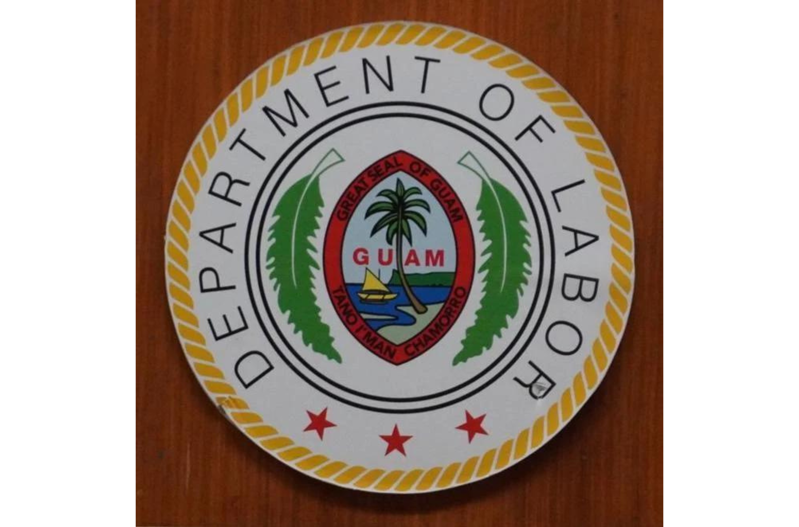 The seal of the Guam Department of Labor is seen on the door to the agency's Hagåtña offices on March 16, 2023.