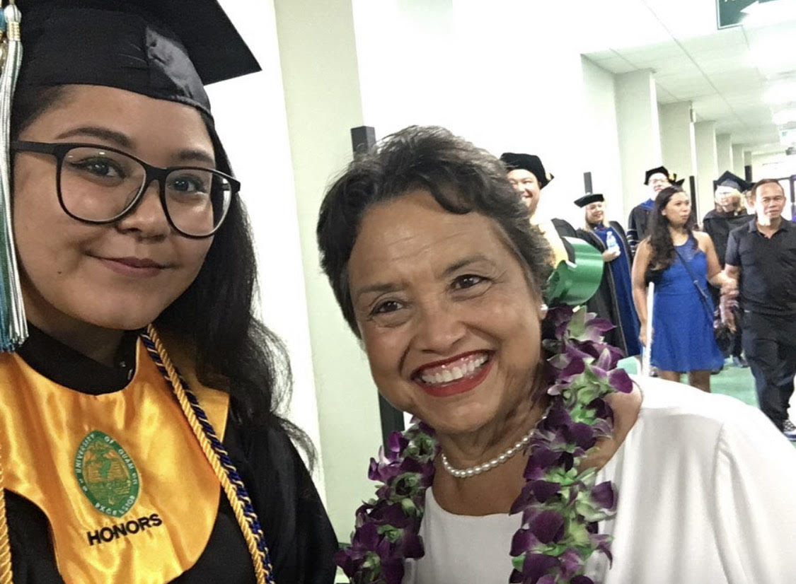 Maria Dolojan takes a photo with Gov. Lou Leon Guerrero at the 2019 Commencement at the University of Guam.