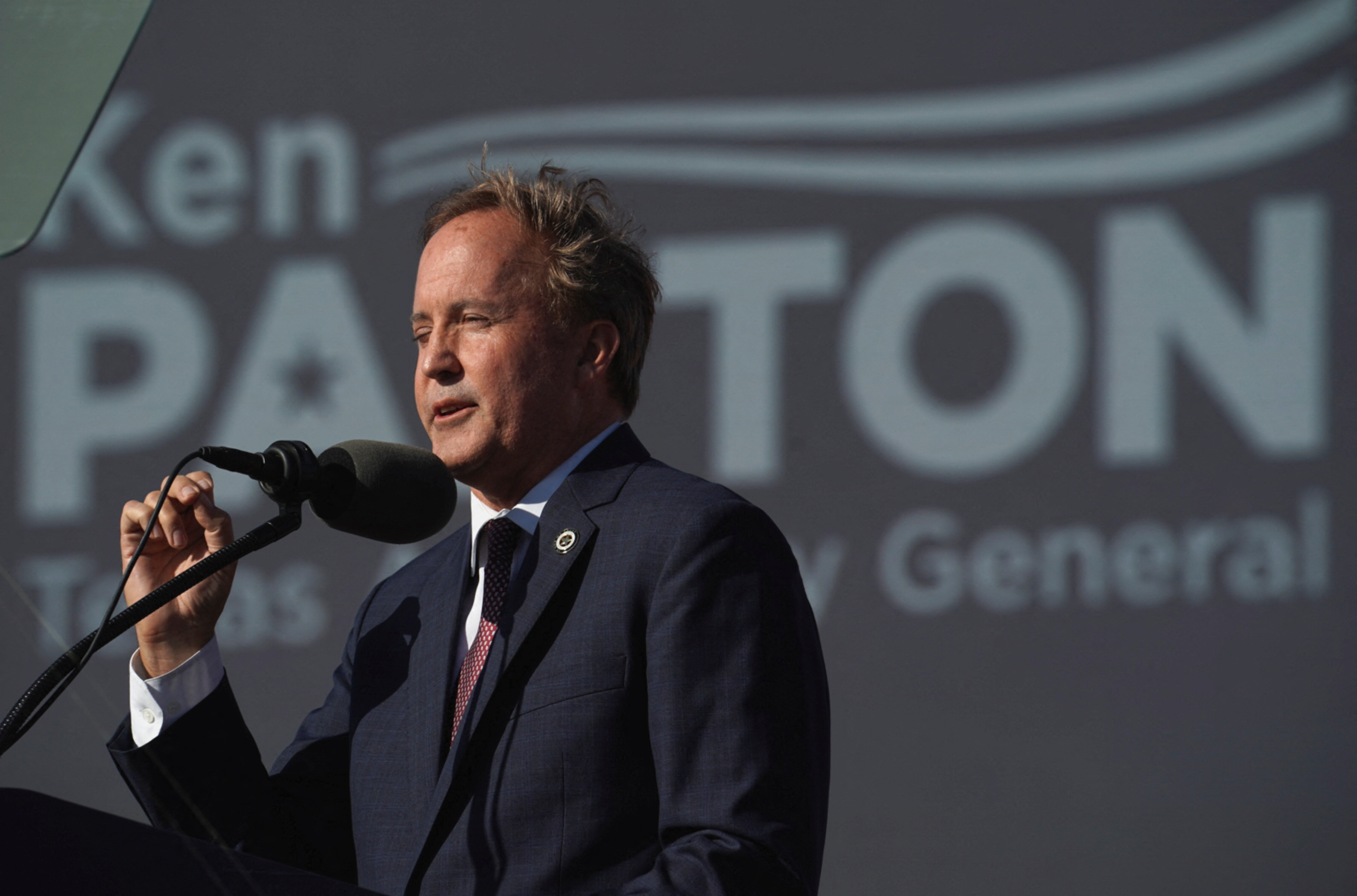 Texas Attorney General Ken Paxton speaks ahead of a rally held by former U.S. President Donald Trump, in Robstown, Texas, U.S., October 22, 2022. REUTERS/Go Nakamura