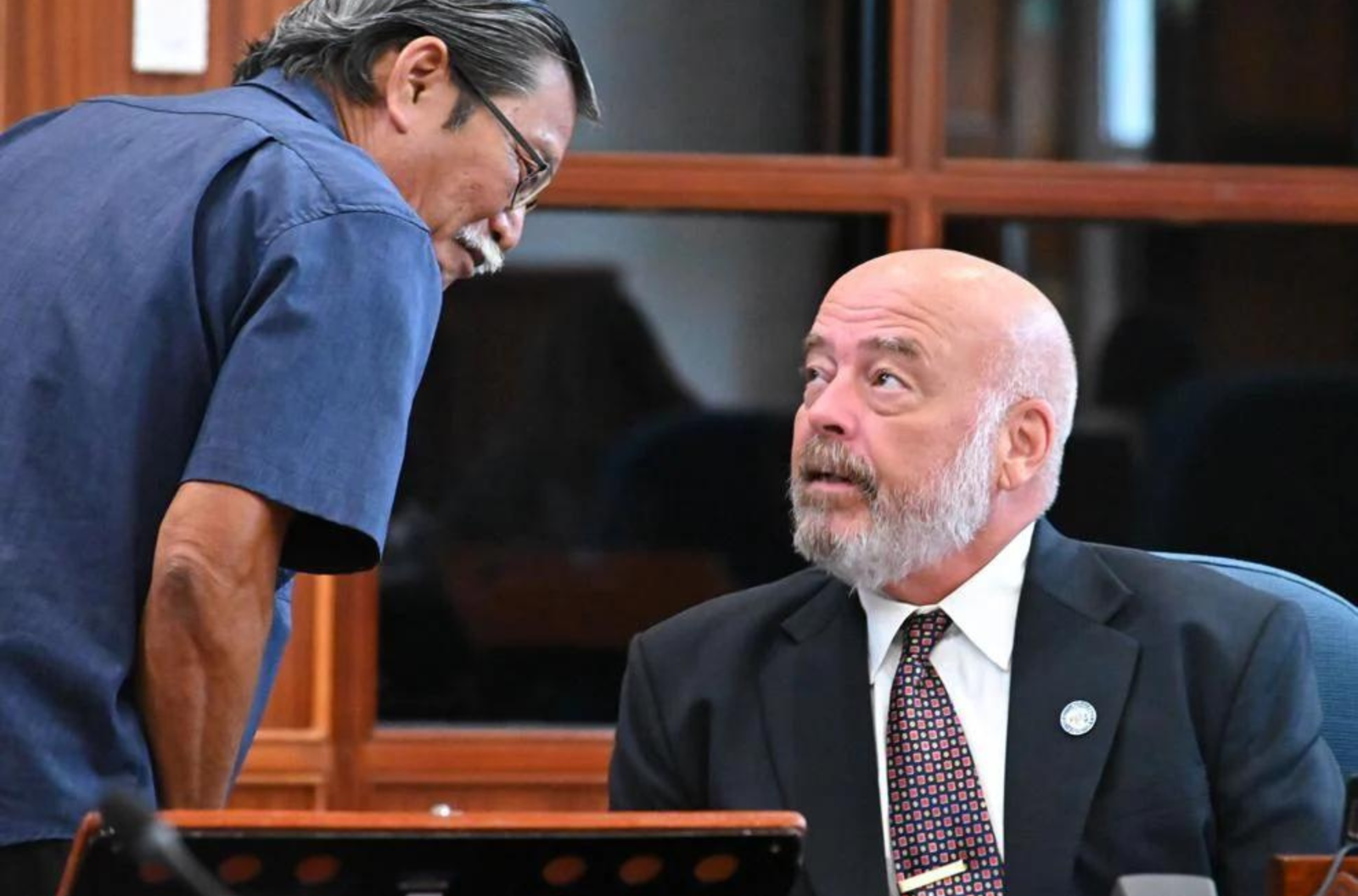 Sens. Joe S. San Agustin, left, and Tom Fisher talk during a break of the Guam Legislature's budget session Thursday, Aug. 10, 2023, in the Guam Congress Building in Hagåtña. 