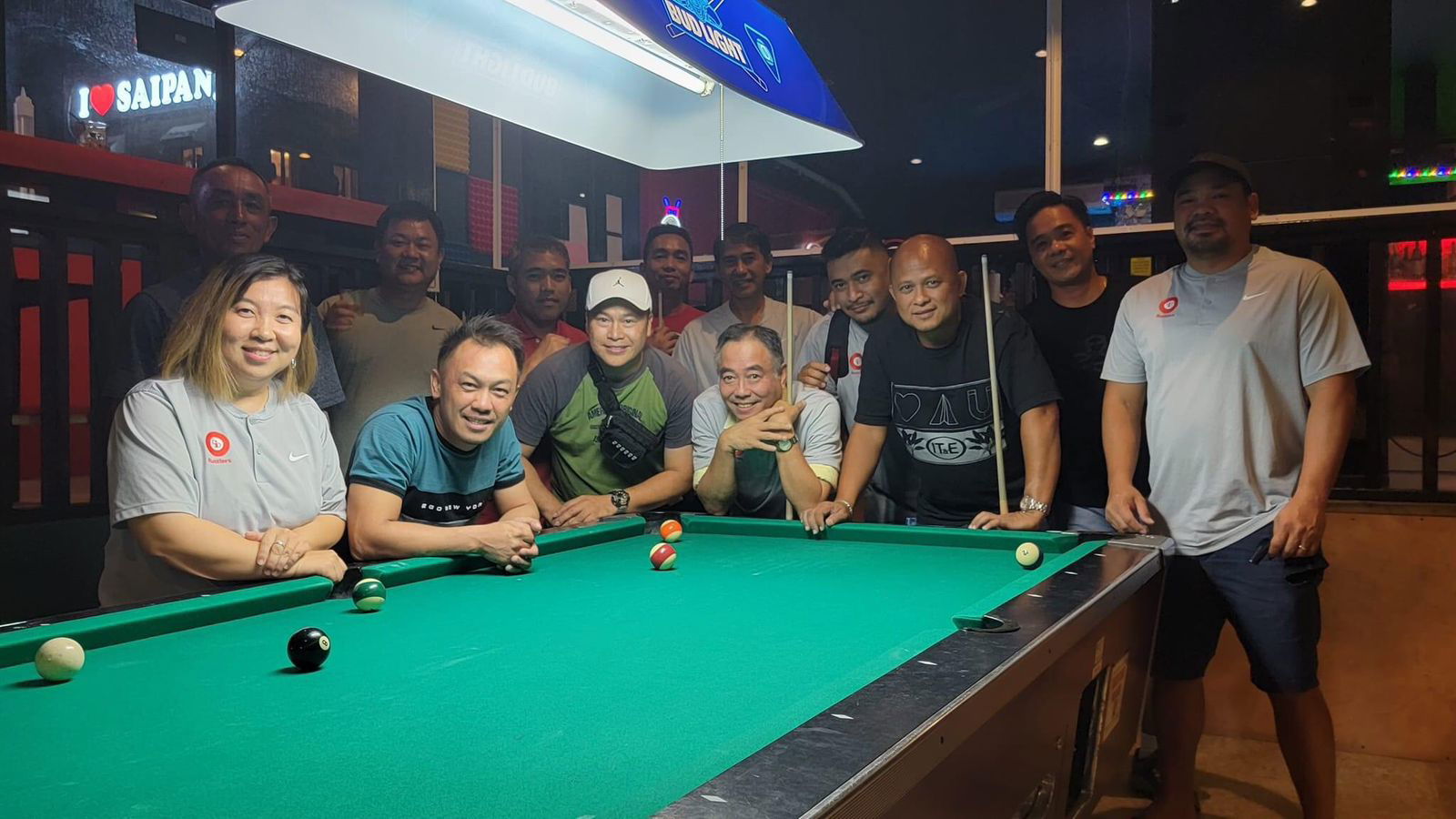 The Rendezvous IT&E Destroyers and the Black 8 Ideal Signs Rustlers pose for a photo after their Tuesday division game in the 2023 SBA Budweiser Open 8-Ball League at the Black 8 Pool Bar.