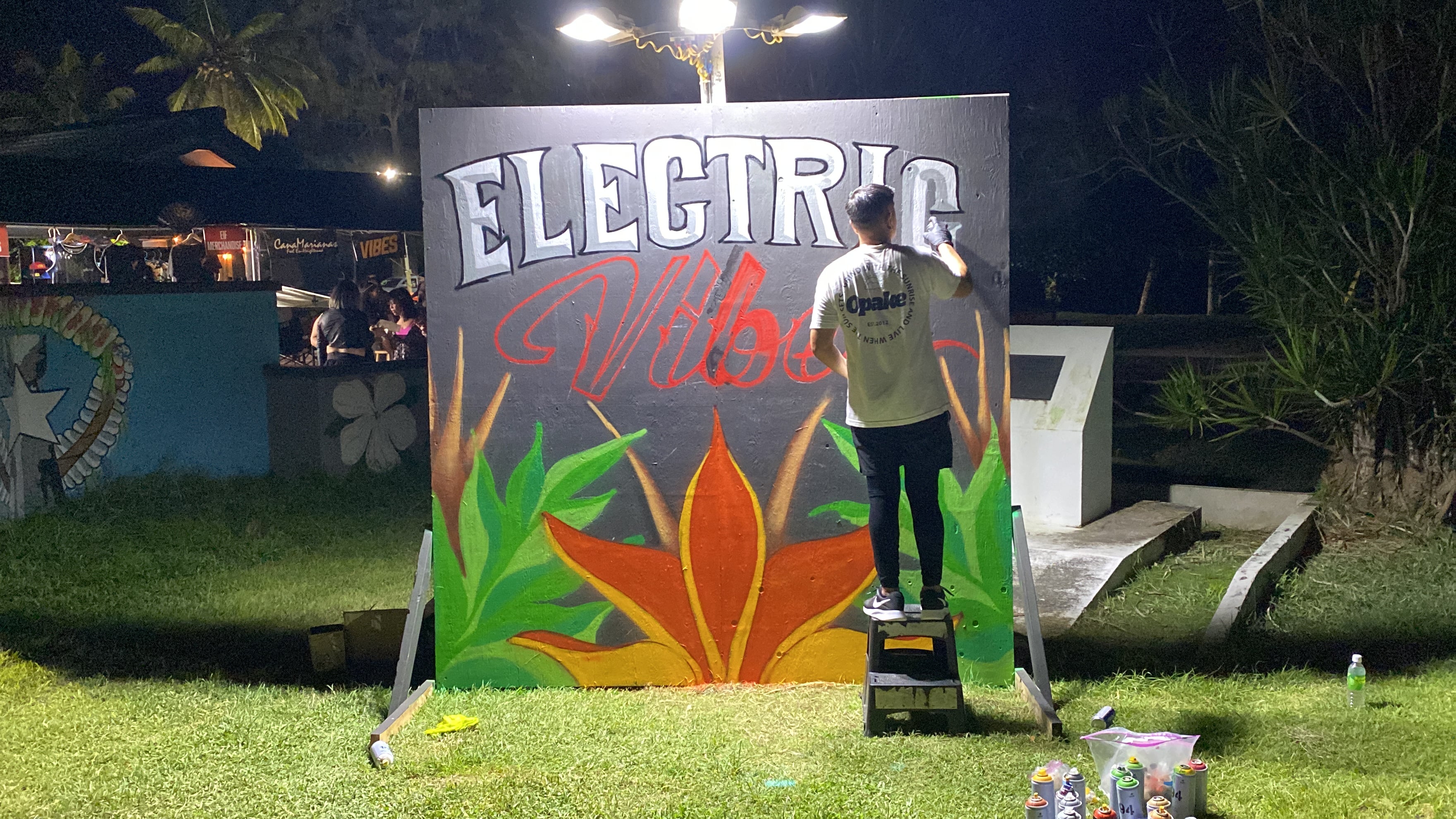 Street artist SOIS works on his art installation at Guma Sakman Beach during EIF Saipan.