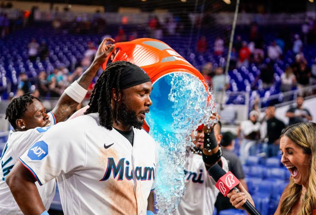 Miami Marlins first baseman Josh Bell (9) is given a Gatorade bath after defeating the Philadelphia Phillies at loanDepot Park in Miami, Florida, Aug. 2, 2023.