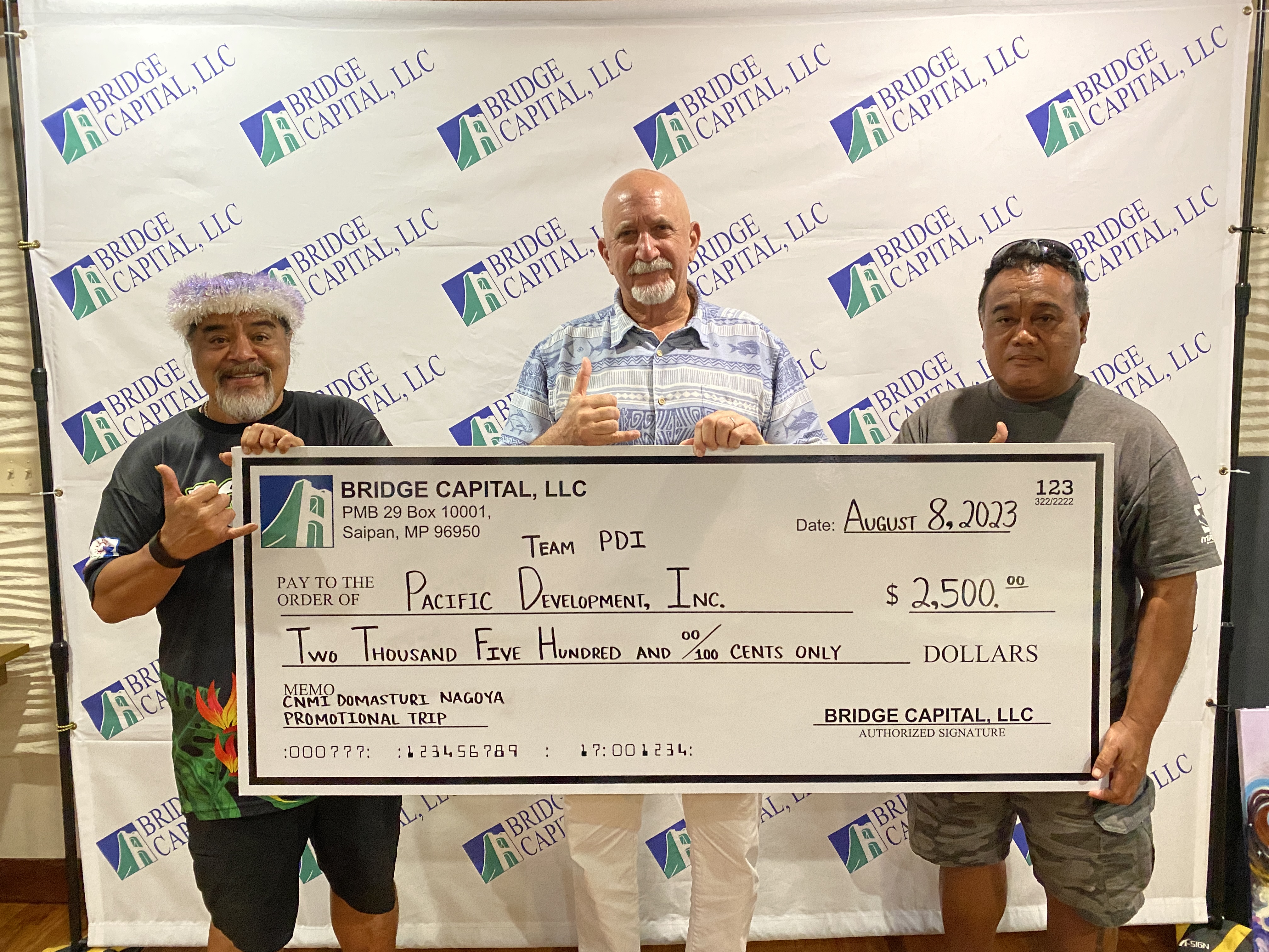 Bridge Capital LLC, represented by its general manager, Bart Jackson, center, donated $2,500 to the CNMI Domatsuri dancers who will perform at the Nippon Domannaka Festival in Nagoya, Japan later this month.
