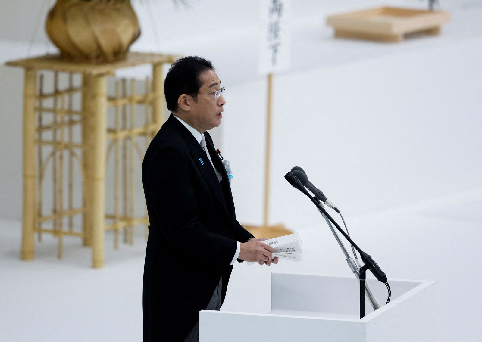 Japan's Prime Minister Fumio Kishida delivers a speech during a memorial service marking the 78th anniversary of Japan's surrender in World War Two at Nippon Budokan Hall in Tokyo, Japan August 15, 2023. REUTERS/Issei Kato/File Photo