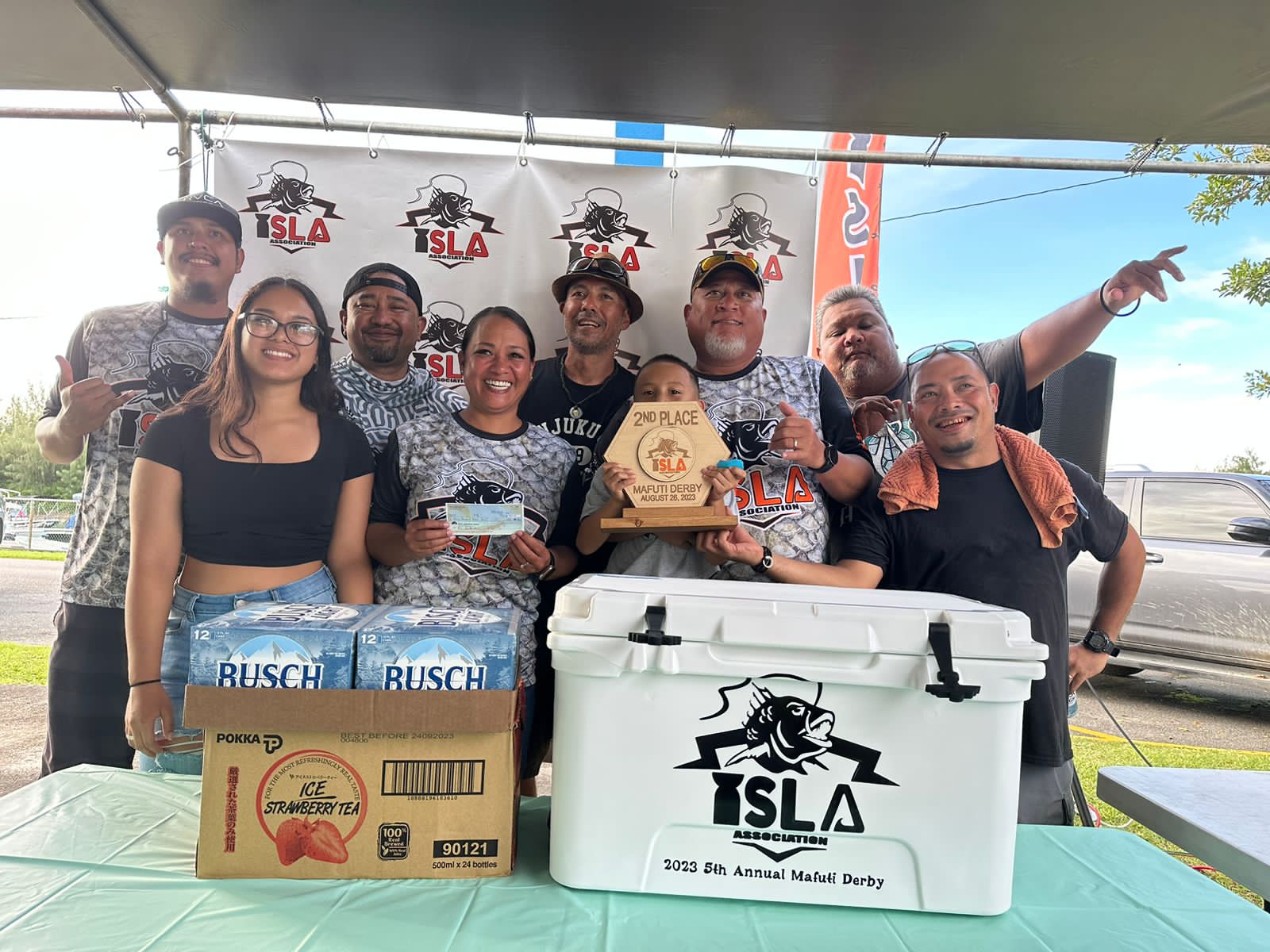 Frank Pangelinan, captain of the WTF Where's the Fish, which won second prize, poses with I Sanhalom Laguna Anglers Association President Keith Kintol and board members during the awards ceremony of the 5th Annual ISLA Mafuti Derby Saturday at Smiling Cove Marina.