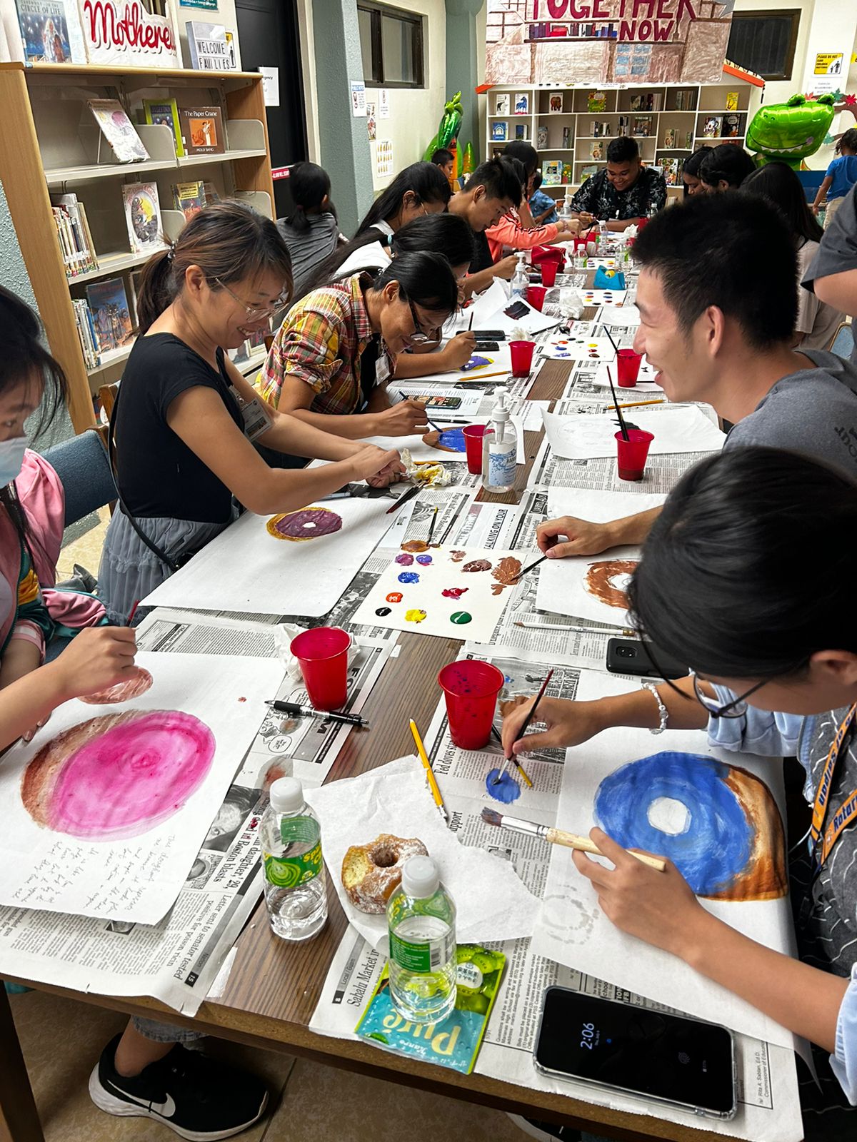 Teen and adult donut painting activity.