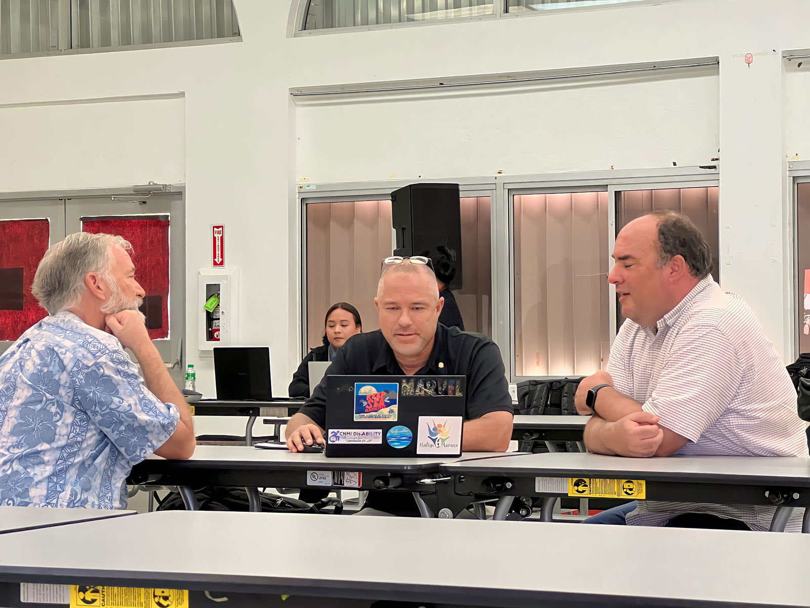 Non-Public School Representative Dr. Ronald Snyder, left, Board of Education Secretary/Treasurer Gregory Pat Borja, center, and legal counsel Michael Ernest, right, exchange ideas during a break from the BOE meeting.