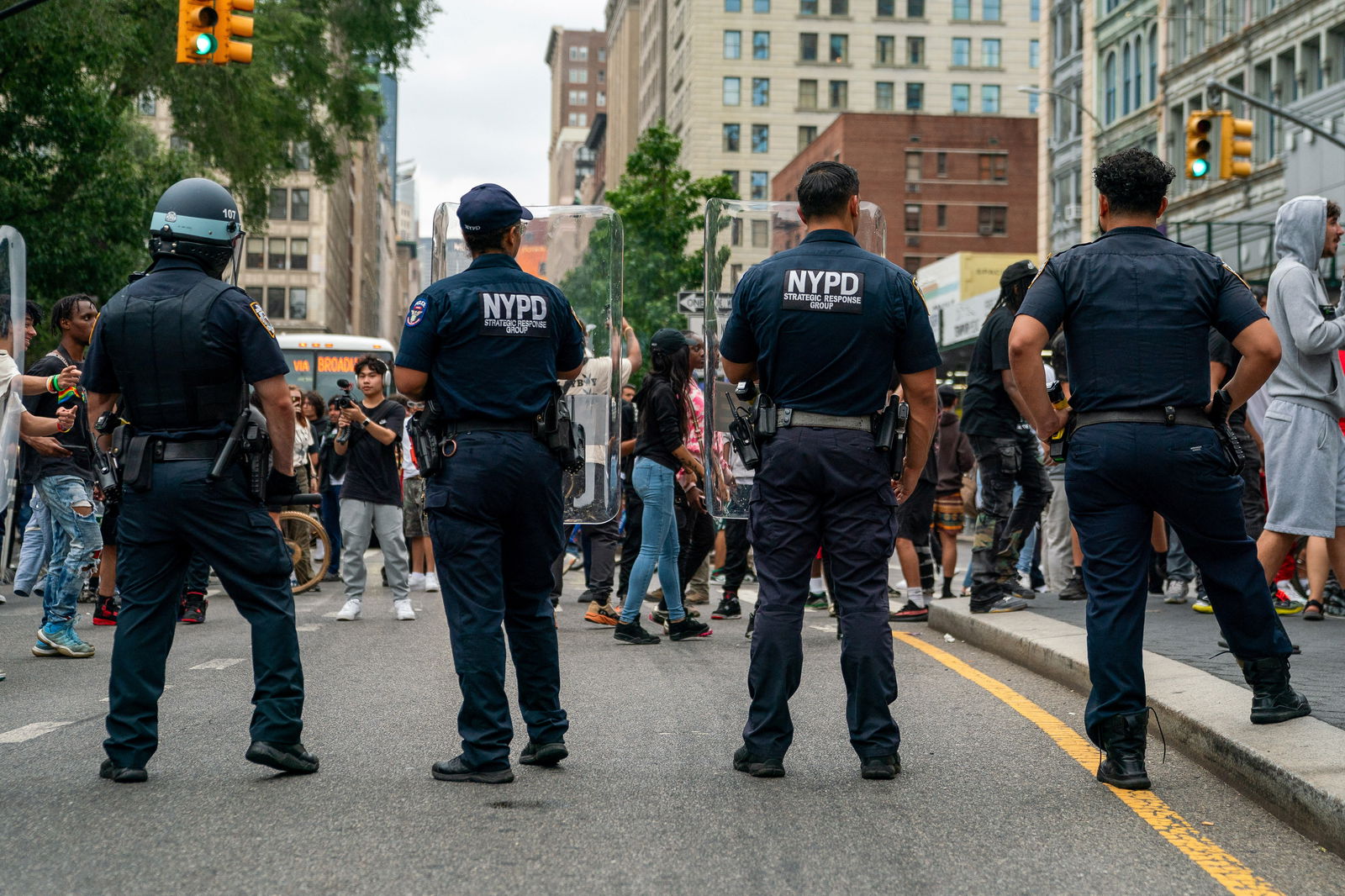 Police officers stand guard as people gather after popular live streamer Kai Cenat announced a "giveaway" event that grew chaotic, prompting police officers to respond and disperse the crowd at Union Square and the surrounding streets, in New York City, U.S. August 4, 2023. REUTERS/David 'Dee' Delgado/File Photo