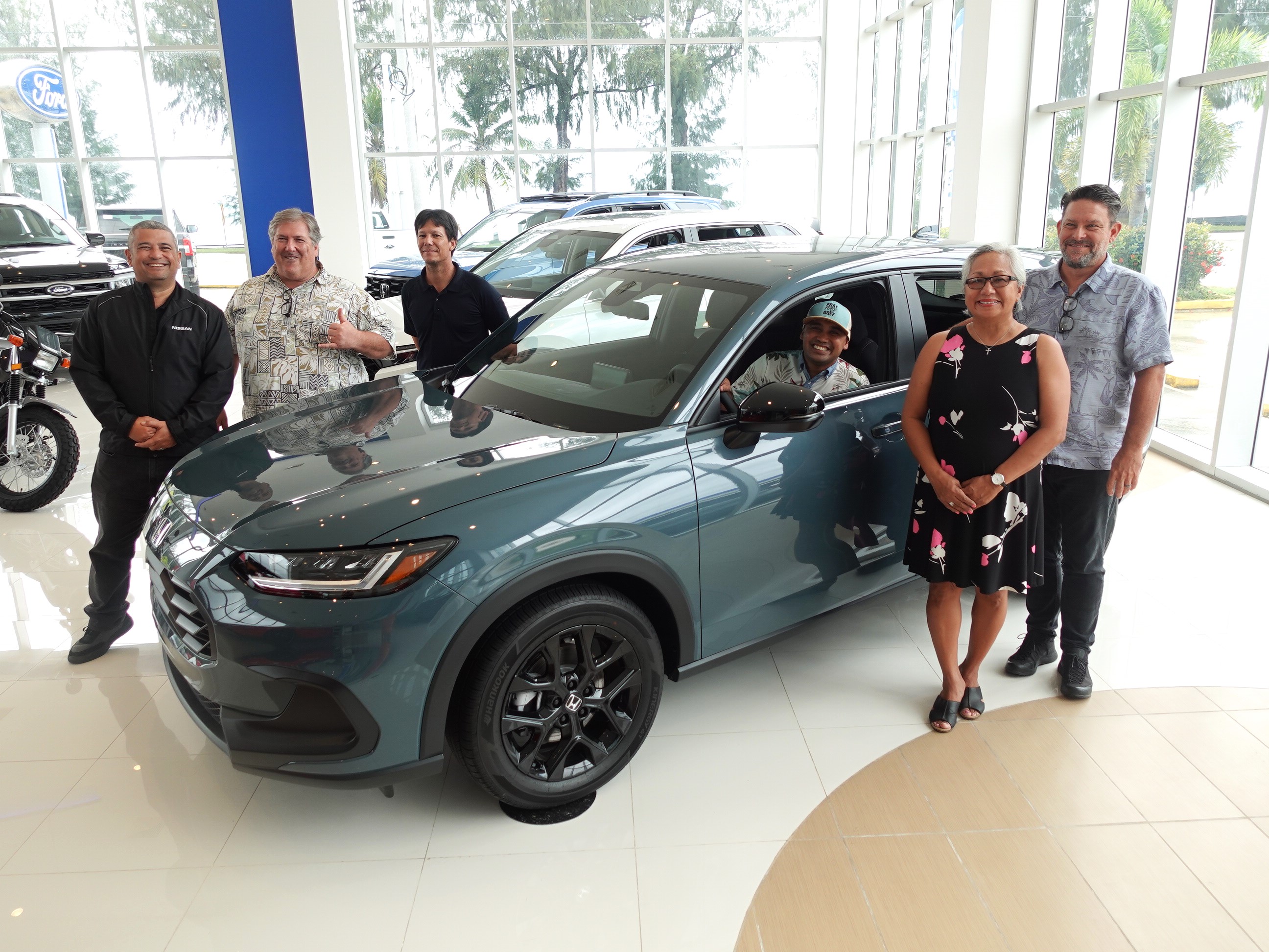 Joeten Motors General Manager Matthew Deets, right, presents 2023 Honda HRV Sport on Aug. 11, 2023, in their showroom in Chalan Laulau, Saipan, as a hole-in-one prize for the Marianas Tourism Golf Classic to be held on Sept. 2, 2023, at LaoLao Bay Golf & Resort.  From left, Joeten Motors Sales Manager Ray Alvarez, tournament committee vice chairman Glenn Policare, Joeten Motors Operations Manager Peter Tenorio, tournament committee member Franco Santos, Marianas Tourism Education Council Chairwoman Vicky Benavente, and Deets.