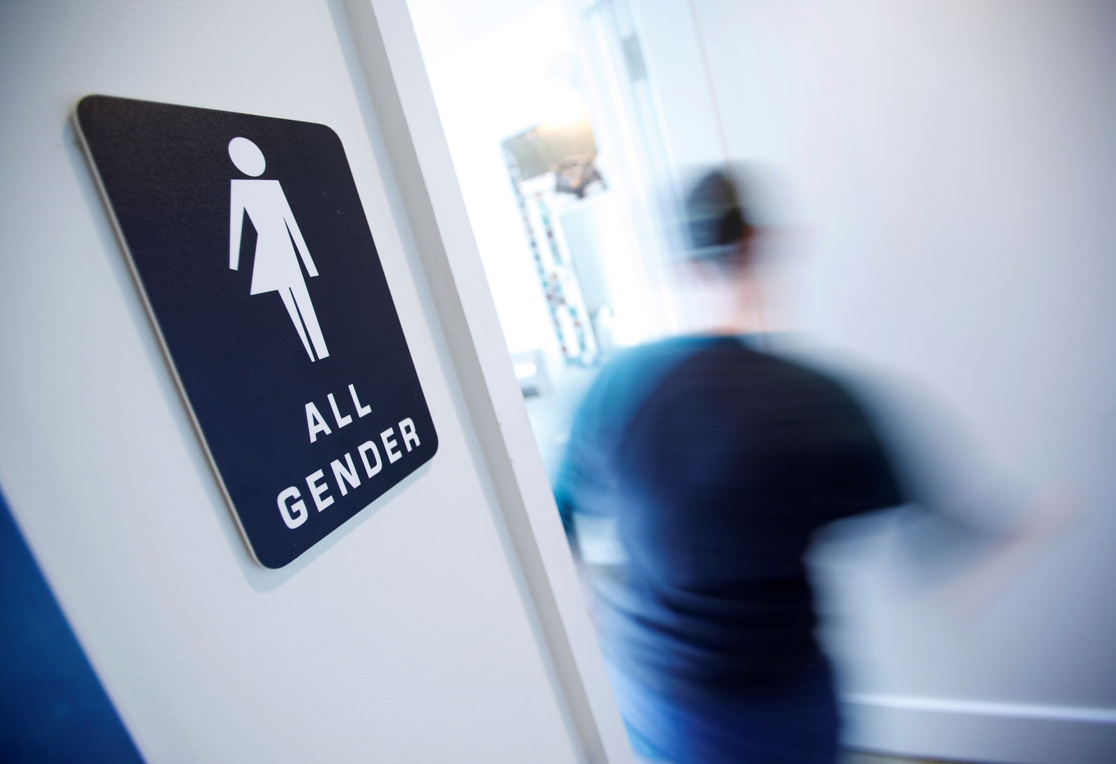 FILE PHOTO: A bathroom sign welcomes both genders at the Cacao Cinnamon coffee shop in Durham, North Carolina, United States on May 3, 2016. REUTERS/Jonathan Drake/File Photo