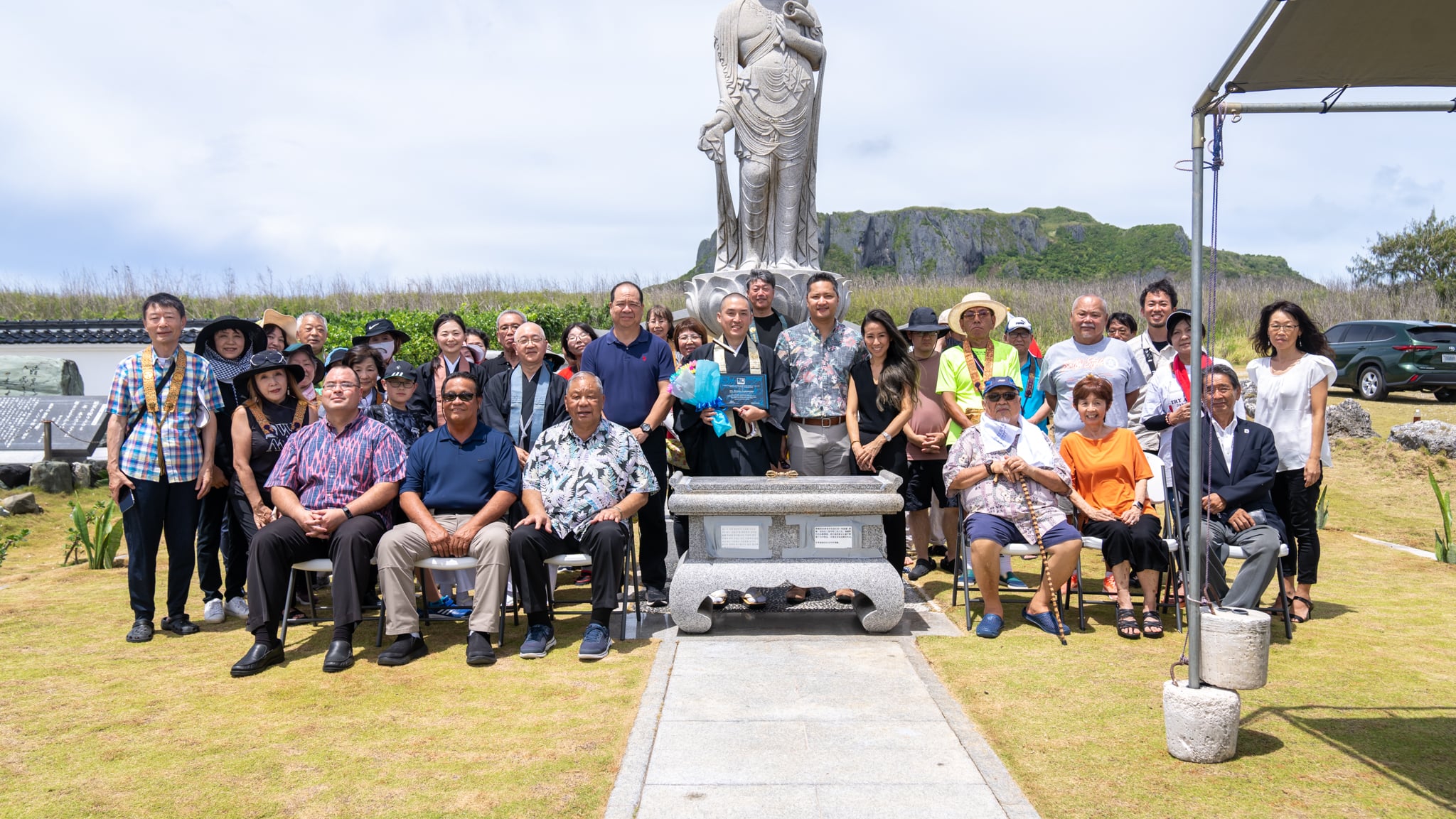 Seated from left, CNMI House Speaker Edmund Villagomez, Saipan Mayor Ramon B. Camacho, CNMI Lt. Gov. David Apatang, former Marianas Visitors Bureau Managing Director JM Guerrero, and other community members, government officials  and members of Shinsho-kai group of Japan attend a memorial service on July 22, 2023, at Banzai Cliff, Saipan. The annual service commemorates individuals, including Japanese citizens, who lost their lives in Saipan during World War II.