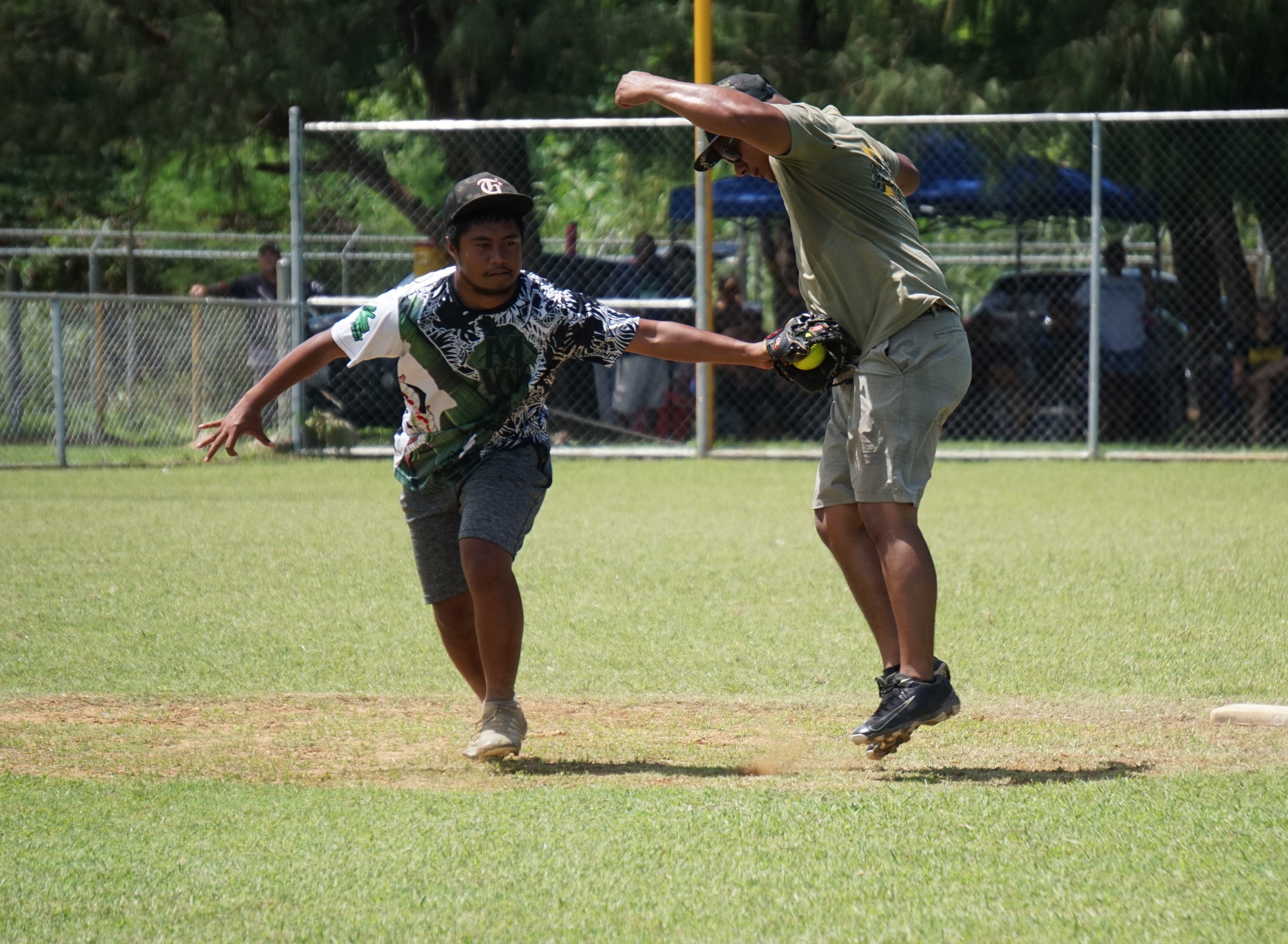 No Choice second baseman Chad Escaner tags a runner for the out during a game of the 2023 Budweiser Belau Amateur Softball Association Open League on Sunday at the Dandan baseball field.