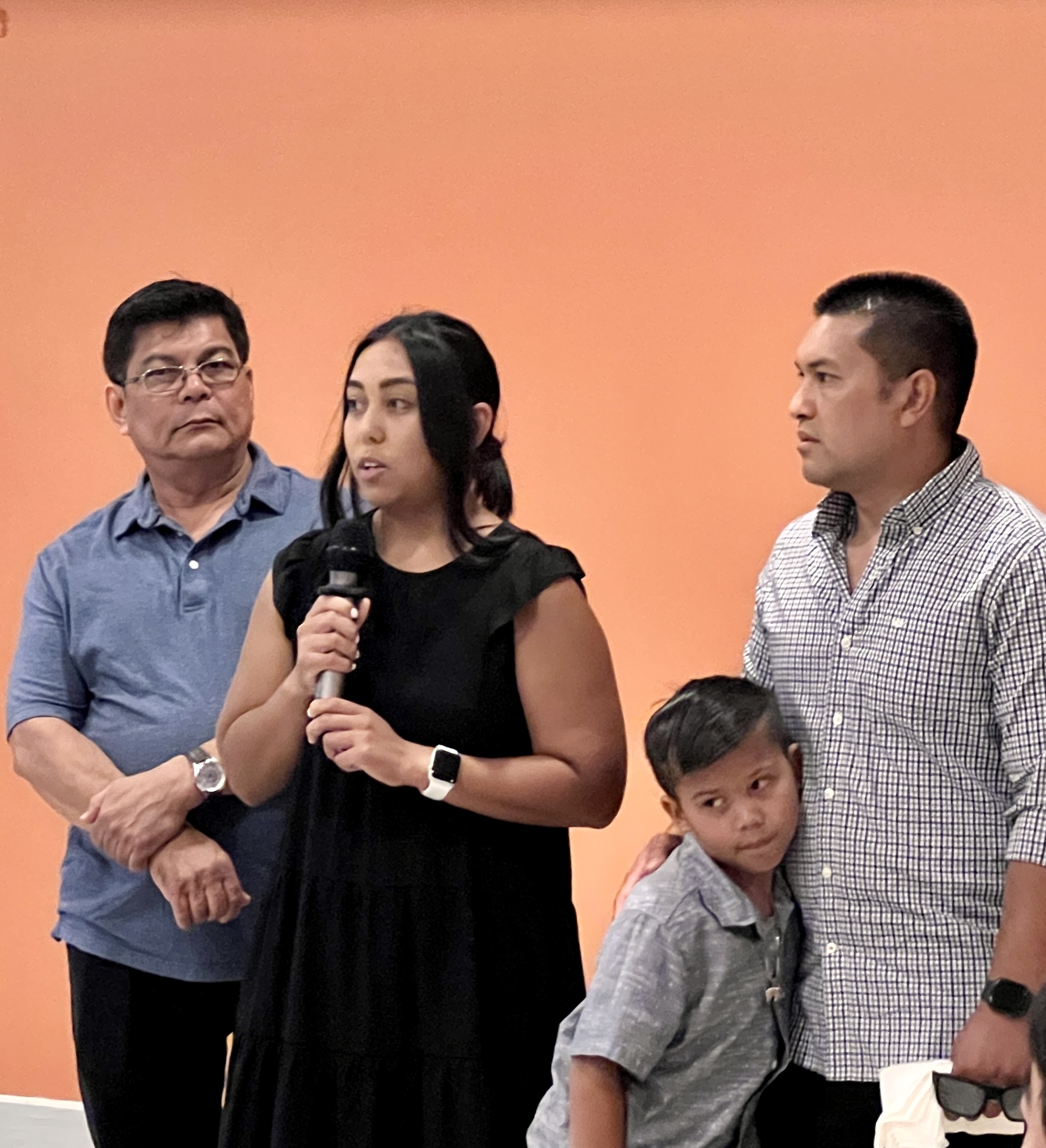 Joaquina Deleon Guerrero “Kinai” Salas’s daughter Jan speaks on behalf of their late mother’s family. With her are her father Vicente, brother Vach and his son.