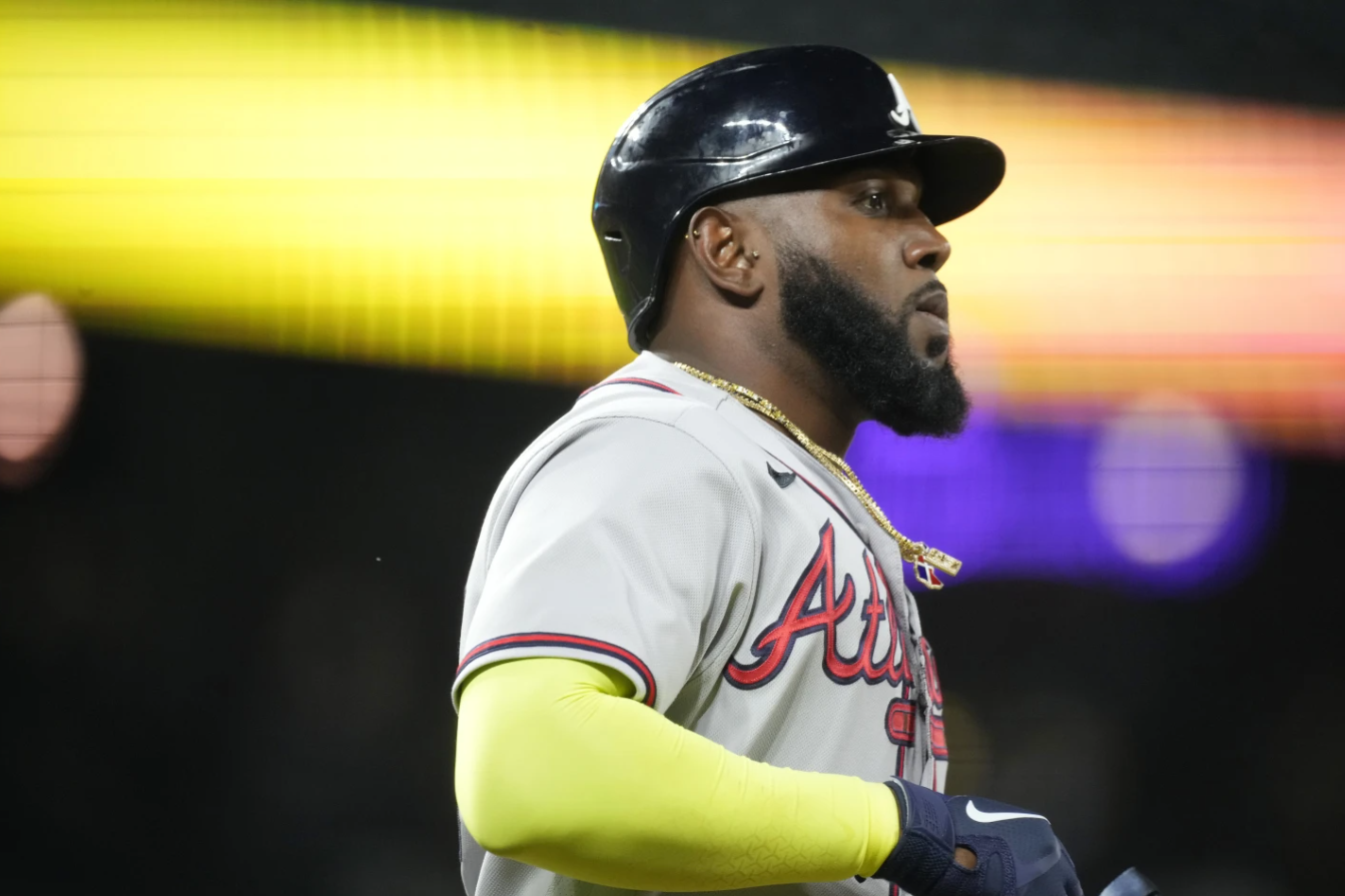Atlanta Braves’ Marcell Ozuna heads to first base after being walked by Colorado Rockies relief pitcher Gavin Hollowell during the seventh inning of a baseball game Tuesday, Aug. 29, 2023, in Denver.