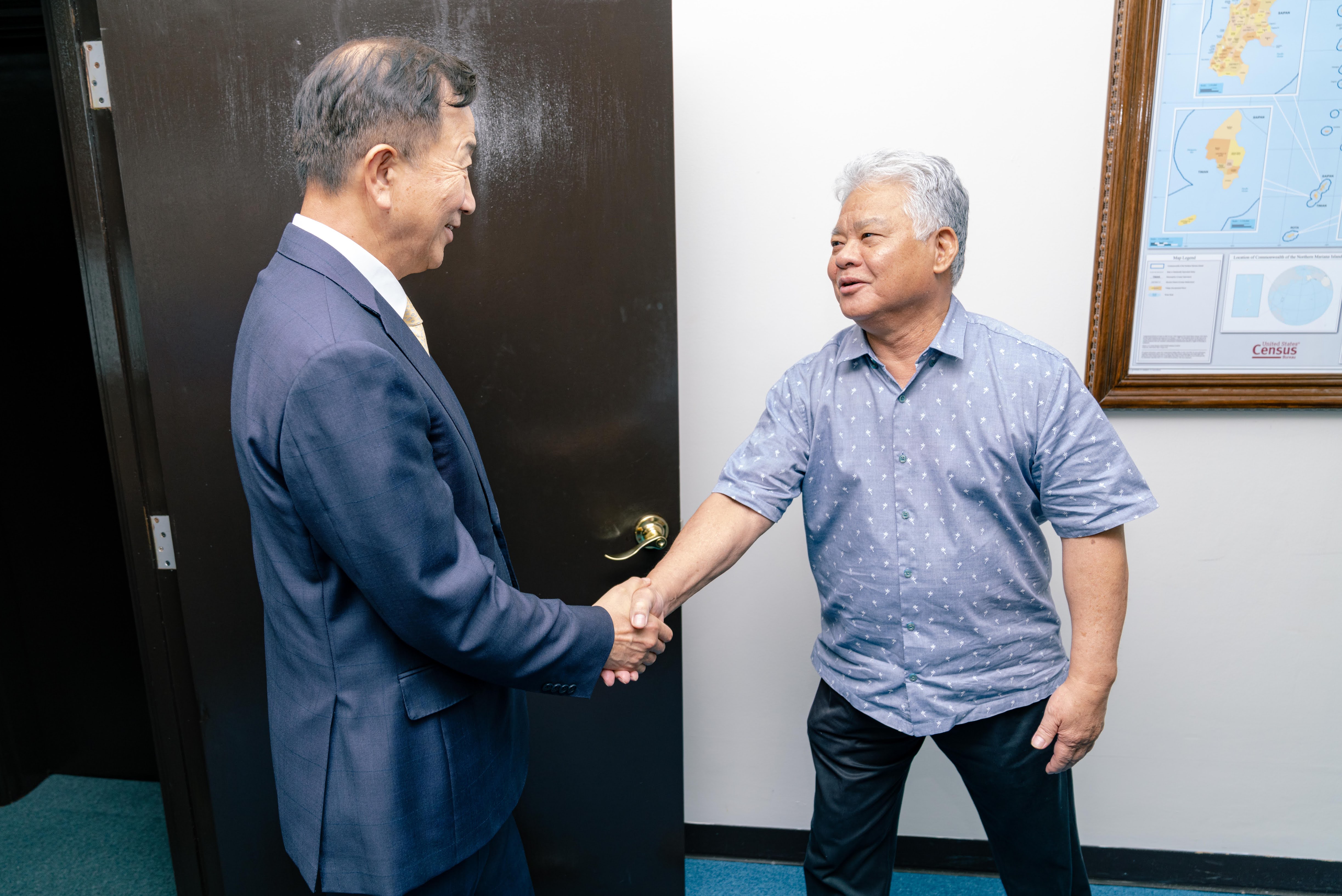 Gov. Arnold I. Palacios shakes hands with Lee Seo Young, the Korean consul general based in Hawaii.