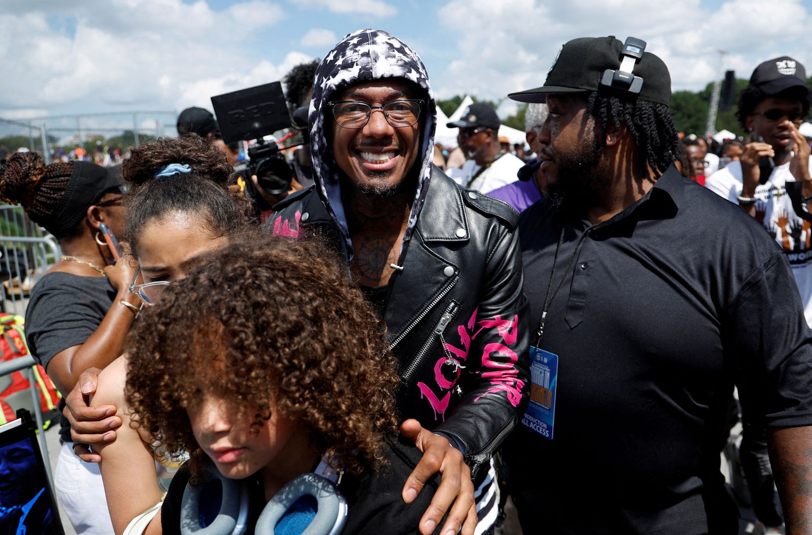 Entertainer and TV presenter Nick Cannon poses next to his children as demonstrators for racial justice gather on the 60th anniversary of the March On Washington and Martin Luther King Jr's historic "I Have a Dream" speech at the Lincoln Memorial in Washington D.C, U.S., August 26, 2023. REUTERS/Jonathan Ernst