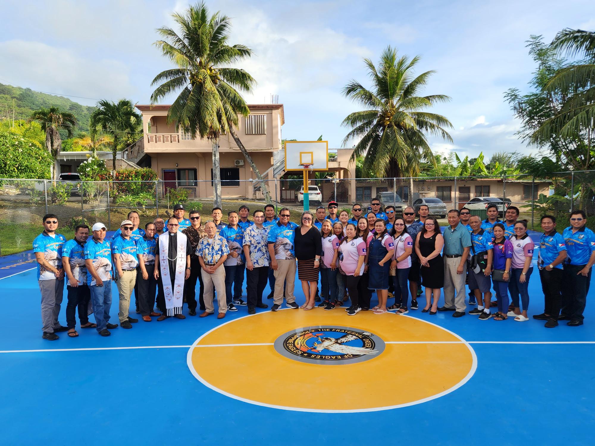 At the newly re-painted Gualo Rai basketball court, members and officers of the Saipan Eagles pose for a photo with Saipan Mayor Ramon “RB” Camacho, Sen. Francisco Cruz, Senate President Edith Deleon Guerrero, Department of Lands and Natural Resources Secretary Sylvan Igisomar, Rev. Fr. Rey D. Rosal, Reps. Roy Ada, Vicente Camacho, Malcolm Omar and Julie Ogo.