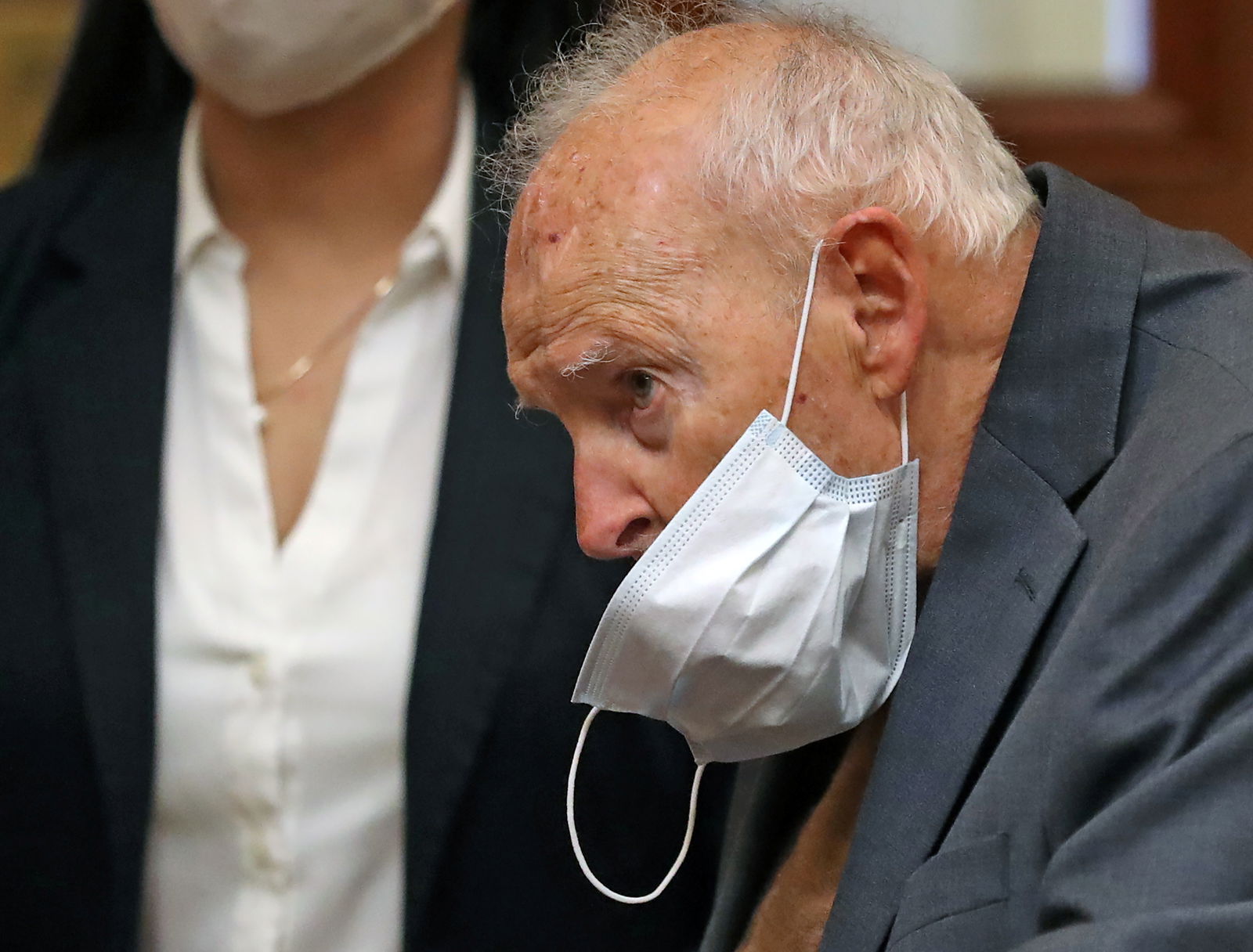 Former Roman Catholic Cardinal Theodore McCarrick wears a mask during arraignment at Dedham District Court, facing charges that he sexually assaulted a 16-year-old boy during a wedding reception at Wellesley College in 1974, in Dedham, Massachusetts, U.S., September 3, 2021. David L Ryan/Pool via REUTERS/File photo