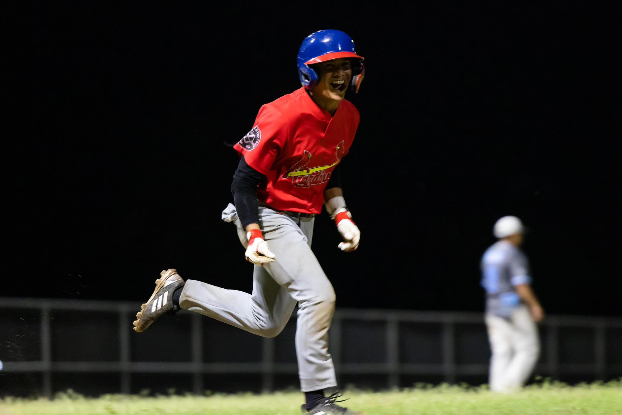 The Cardinals' Pat Tenorio celebrates after scoring a run during a Tan Holdings Saipan Baseball League game at the Francisco "Tan Ko" Palacios Baseball Field.