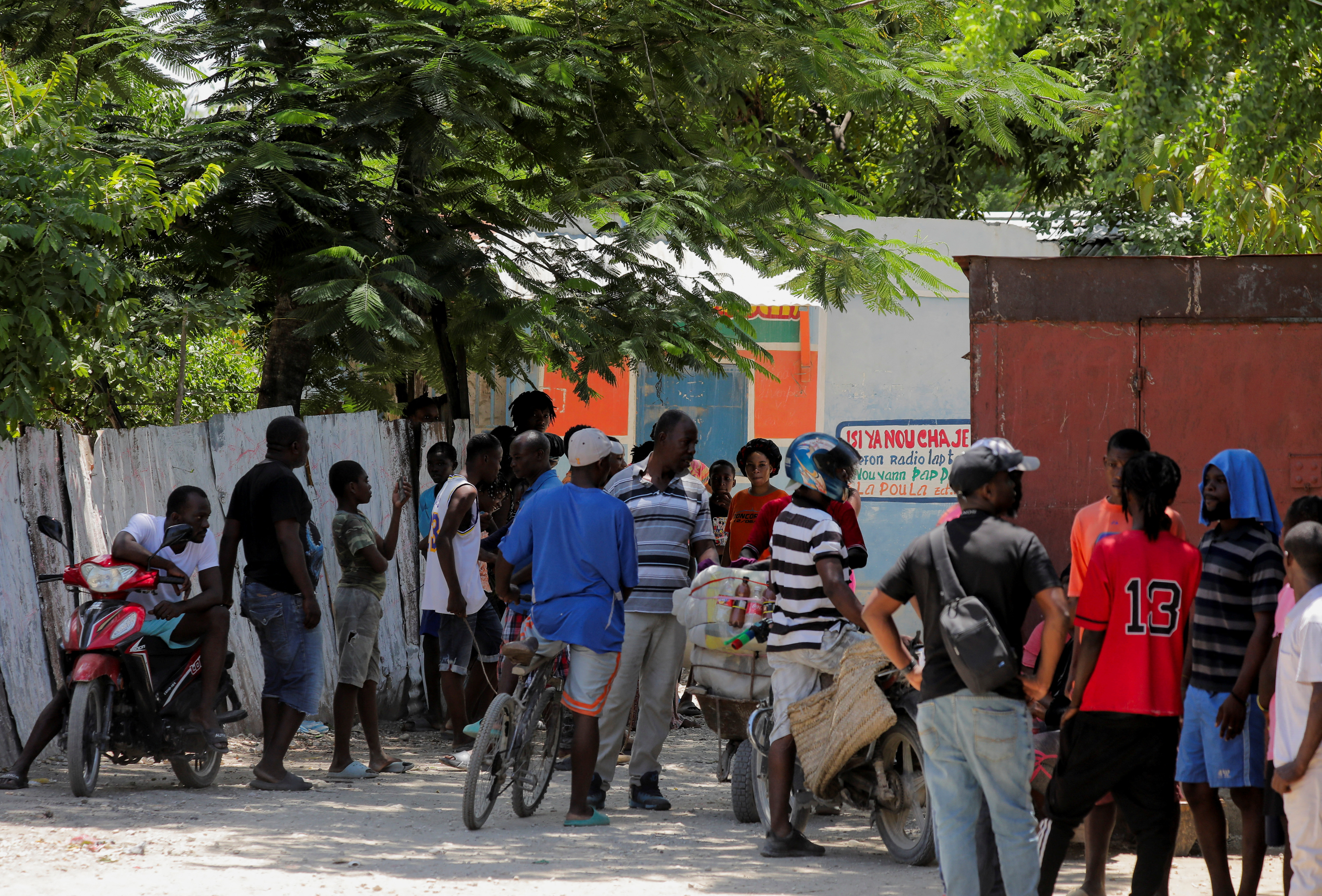 People gather after U.S. nurse Alix Dorsainvil, from the humanitarian aid organization El Roi Haiti, and her child were safely released following their kidnapping in Haiti two weeks ago, outside the installations of El Roi Haiti in Cite Soleil, in Port-au-Prince, Haiti August 9, 2023. REUTERS/Ralph Tedy Erol
