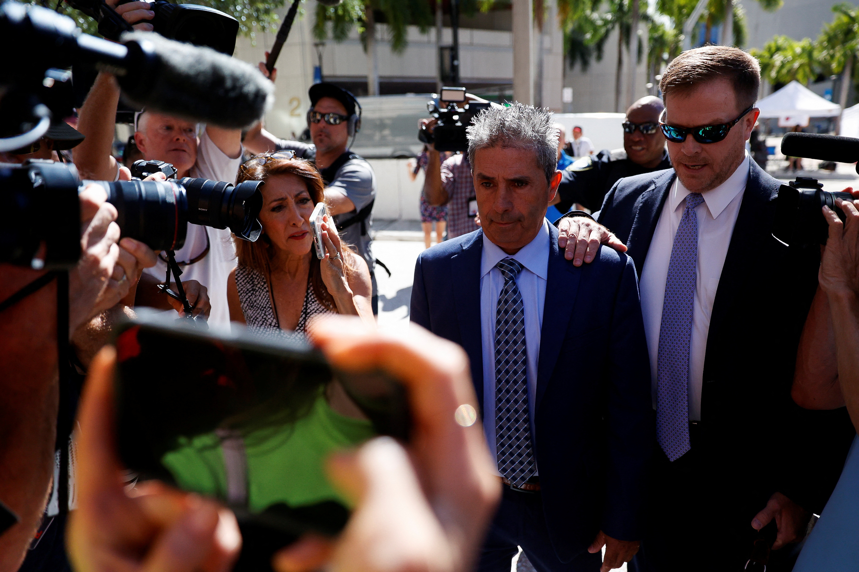 Carlos De Oliveira, the property manager of former U.S. President Donald Trump's Mar-a-Lago estate, arrives at federal court to face charges related to Trump's retention of classified documents at his Florida resort home, in Miami, Florida, U.S. July 31, 2023. REUTERS/Marco Bello