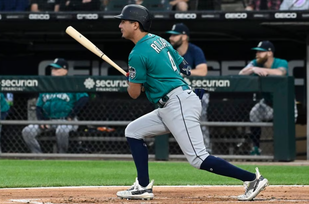 Seattle Mariners third baseman Josh Rojas (4) hits an RBI single against the Chicago White Sox during the first inning at Guaranteed Rate Field in Chicago, Illinois, Aug, 21, 2023.