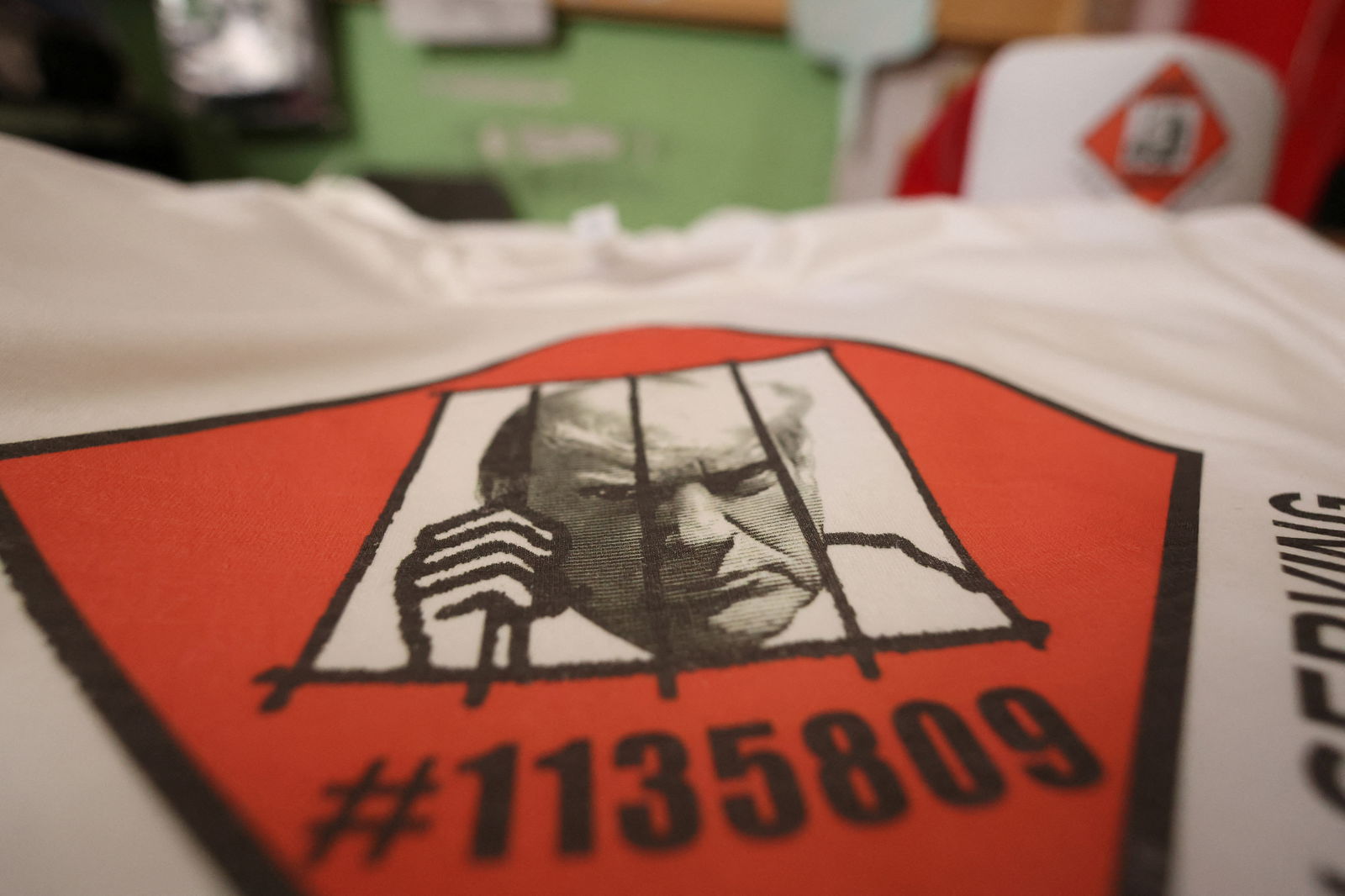 T-shirts and hats with an image depicting the mugshot of former President Donald Trump are pictured at the Y-Que printing store in Los Angeles, California, U.S., August 25, 2023. REUTERS/Mario Anzuoni