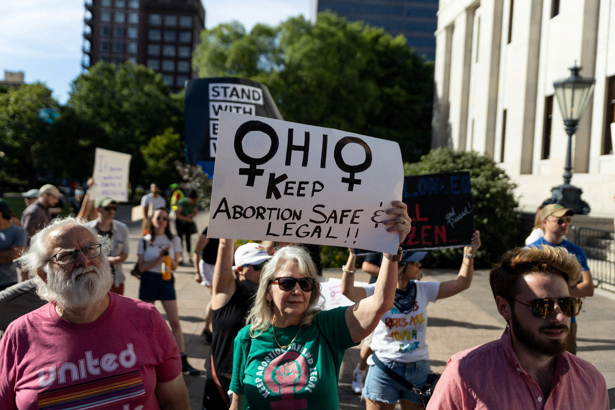 An abortion rights protester holds a sign to keep abortion safe in Ohio at a rally in Columbus, Ohio, after the United States Supreme Court ruled in the Dobbs v Women's Health Organization abortion case, overturning the landmark Roe v Wade abortion decision, June 24, 2022. REUTERS/Megan Jelinger/File Photo