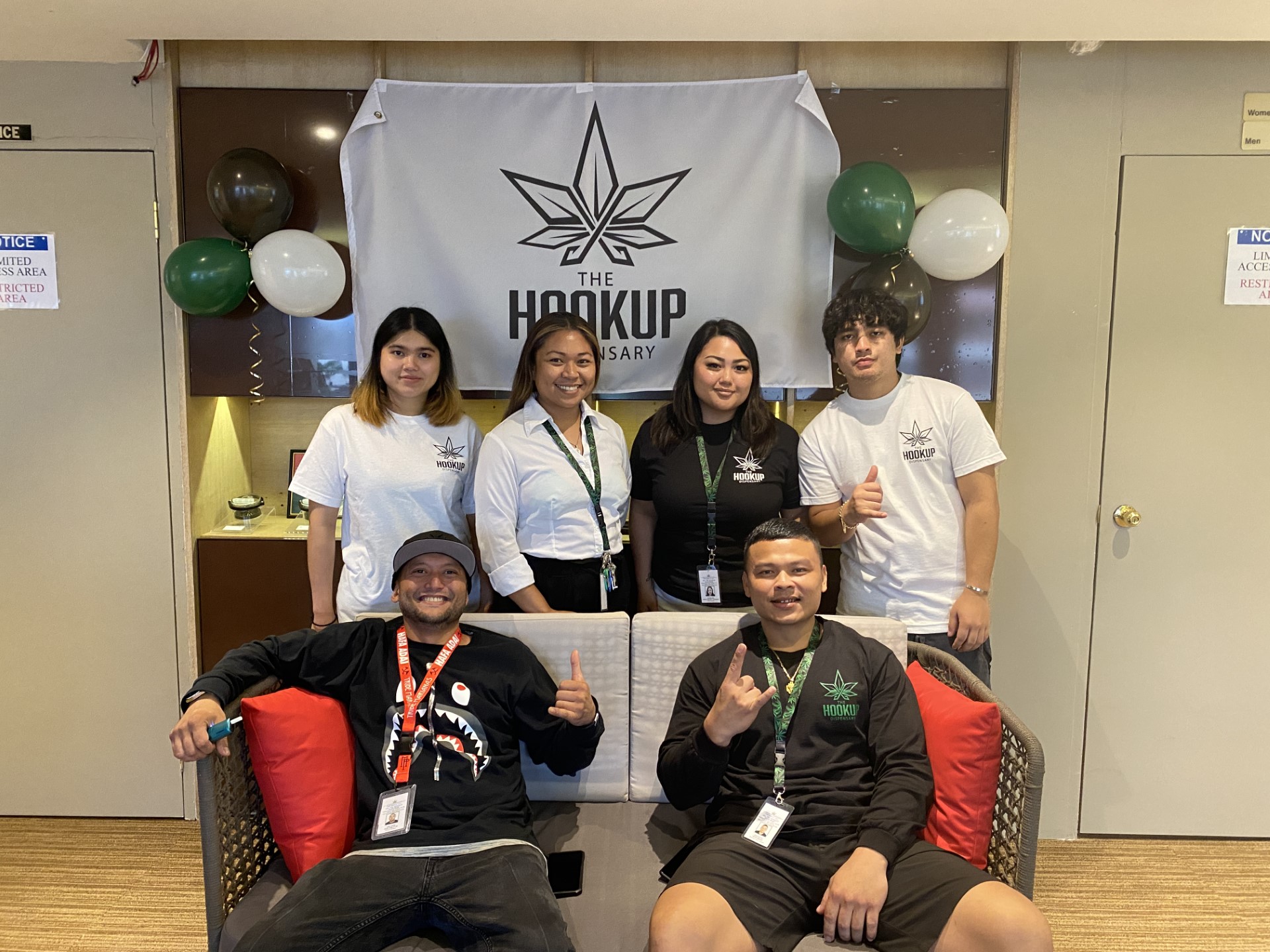 Hook Up staff pose for a picture at their grand opening. Back row: Mild Thompson, staff member; Jen Sambile, operations manager; Krissa Deleon Guerrero, retail manager; Nicolas Quitugua, budtender. Front row, Nick Sablan Jr., general manager; and Irvin Saralu, budtender.