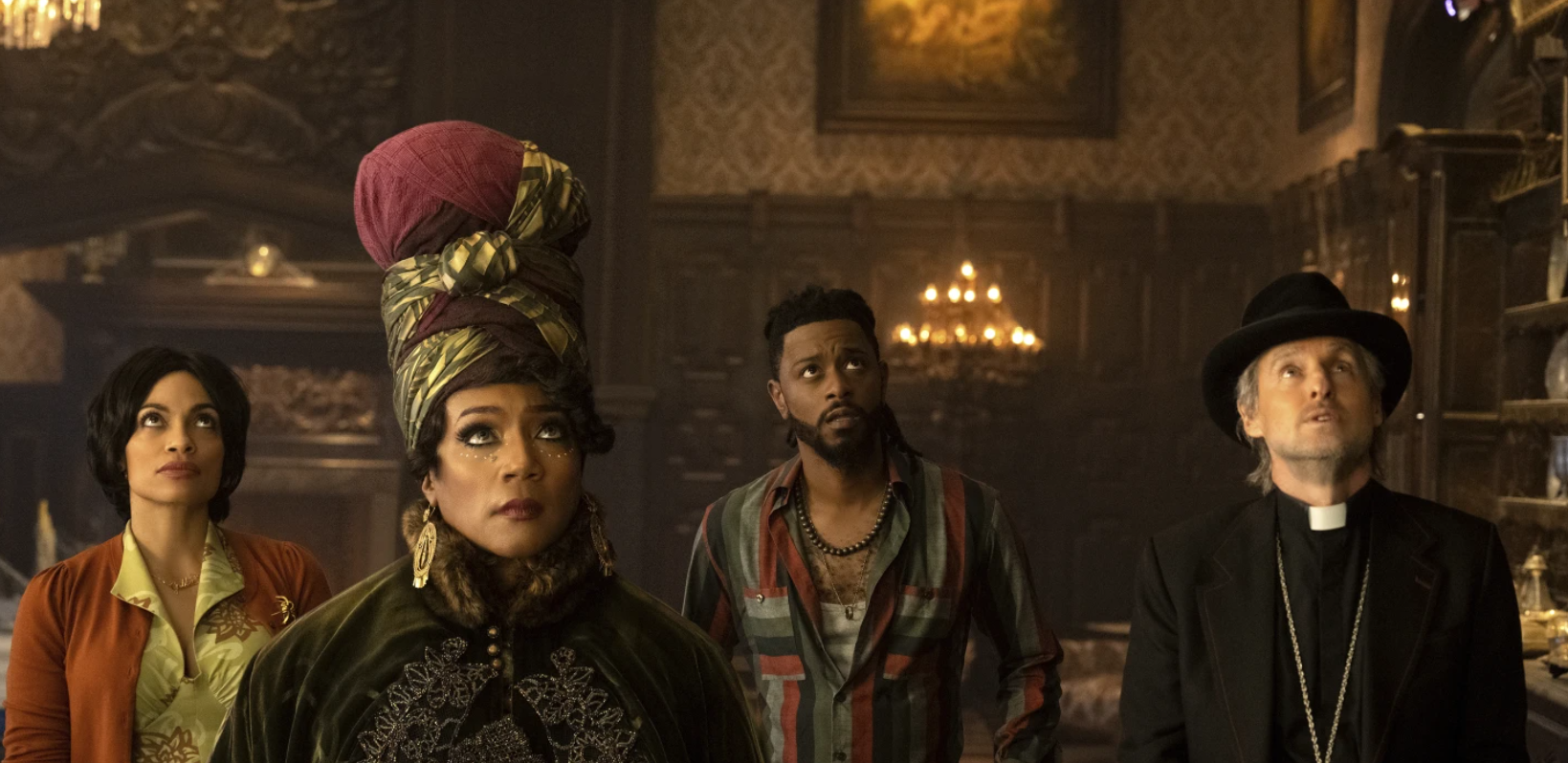 From left, Rosario Dawson, Tiffany Haddish, LaKeith Stanfield and Owen Wilson in a scene from “Haunted Mansion.”