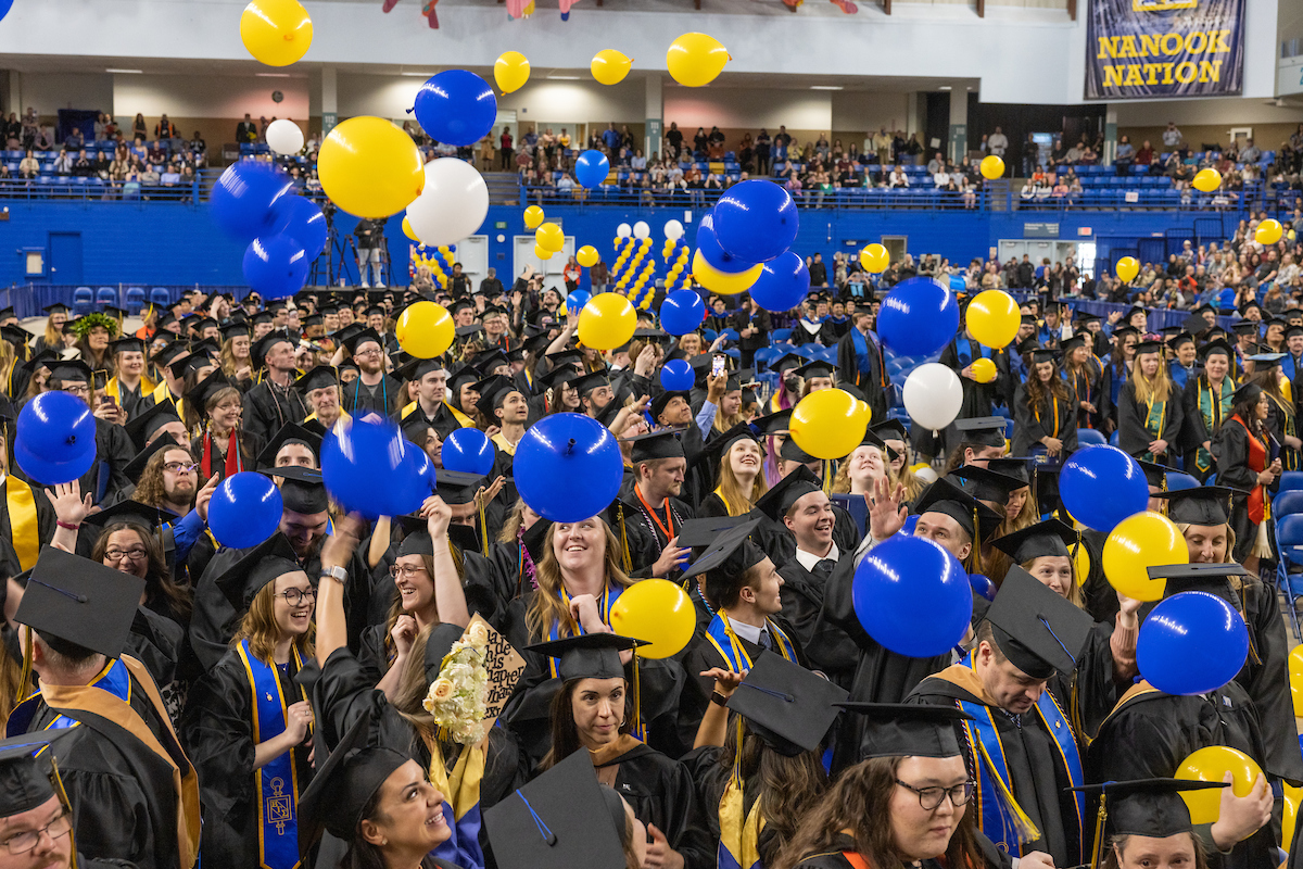 Graduates celebrate during the balloon drop at the University of Alaska Fairbanks 2023 Commencement Ceremony at the Carlson Center Saturday, May 6, 2023.