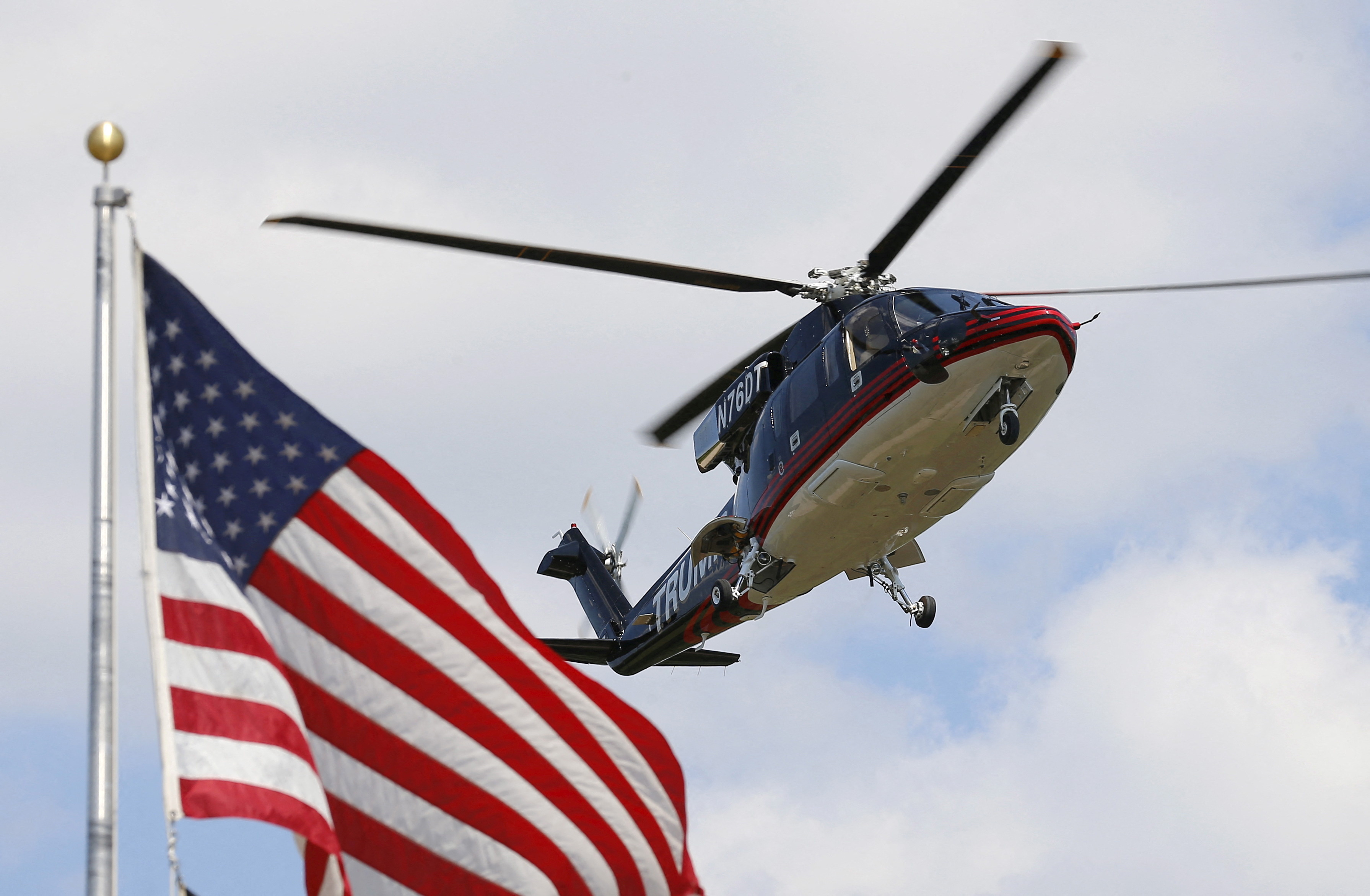 U.S. Republican presidential candidate Donald Trump's helicopter lands in a field before his visit to the Iowa State Fair during a campaign stop in Des Moines, Iowa, United States, August 15, 2015. REUTERS/Jim Young/File Photo