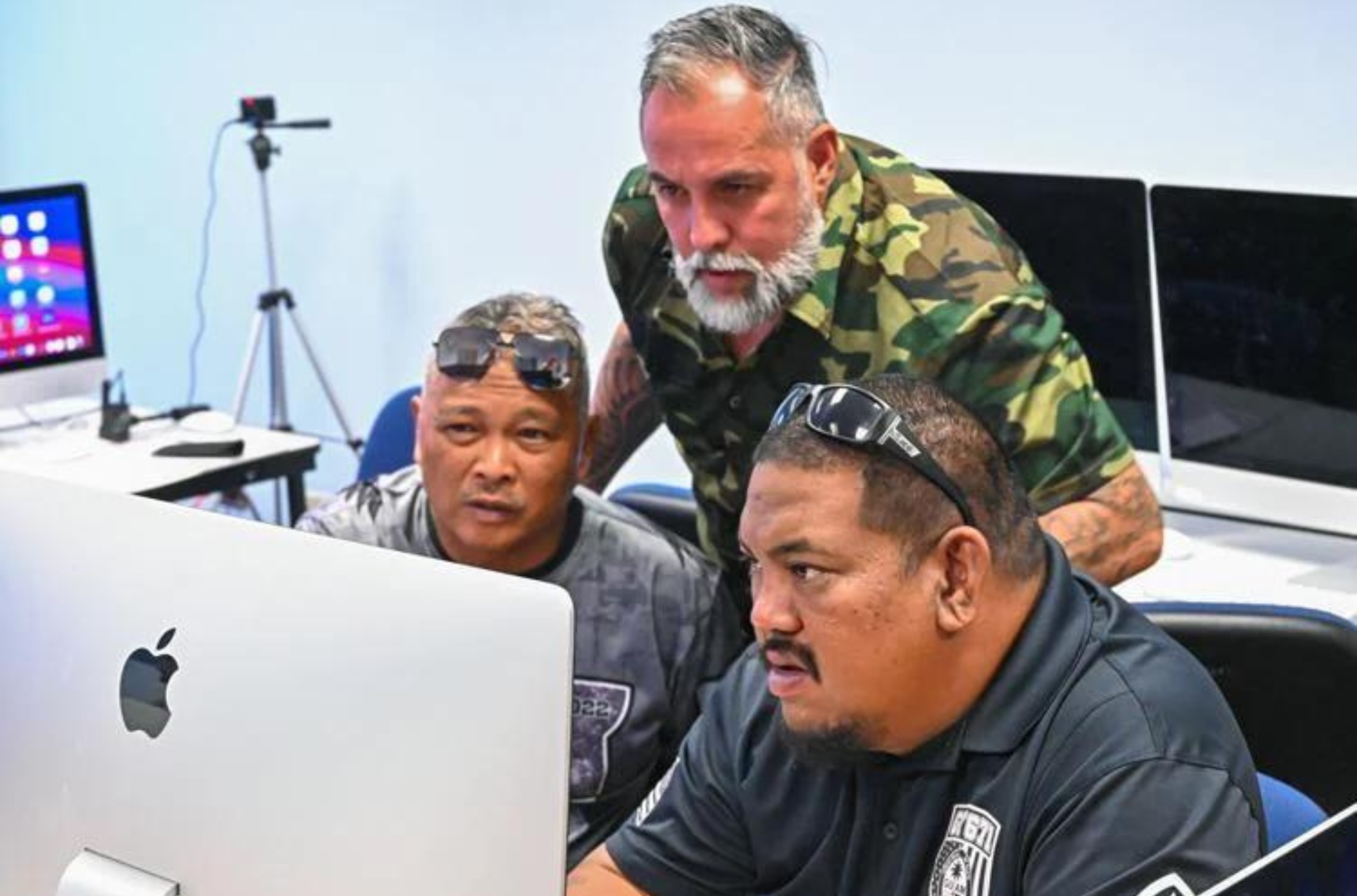 From left, Joe Goden, John Concepcion and Daniel Taijeron work together during the "Voices of Veterans: Masterclass in Visual Storytelling" workshop Tuesday, Aug. 1, 2023, at the University of Guam in Mangilao. 