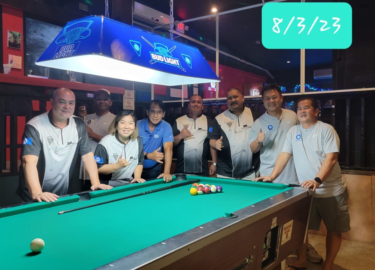 Team members of Black 8 Shake N Break and Saipan Computer Services pose for a photo during a Thursday division game of the 2023 SBA Budweiser Open 8-Ball League at the Black 8 Pool Bar.