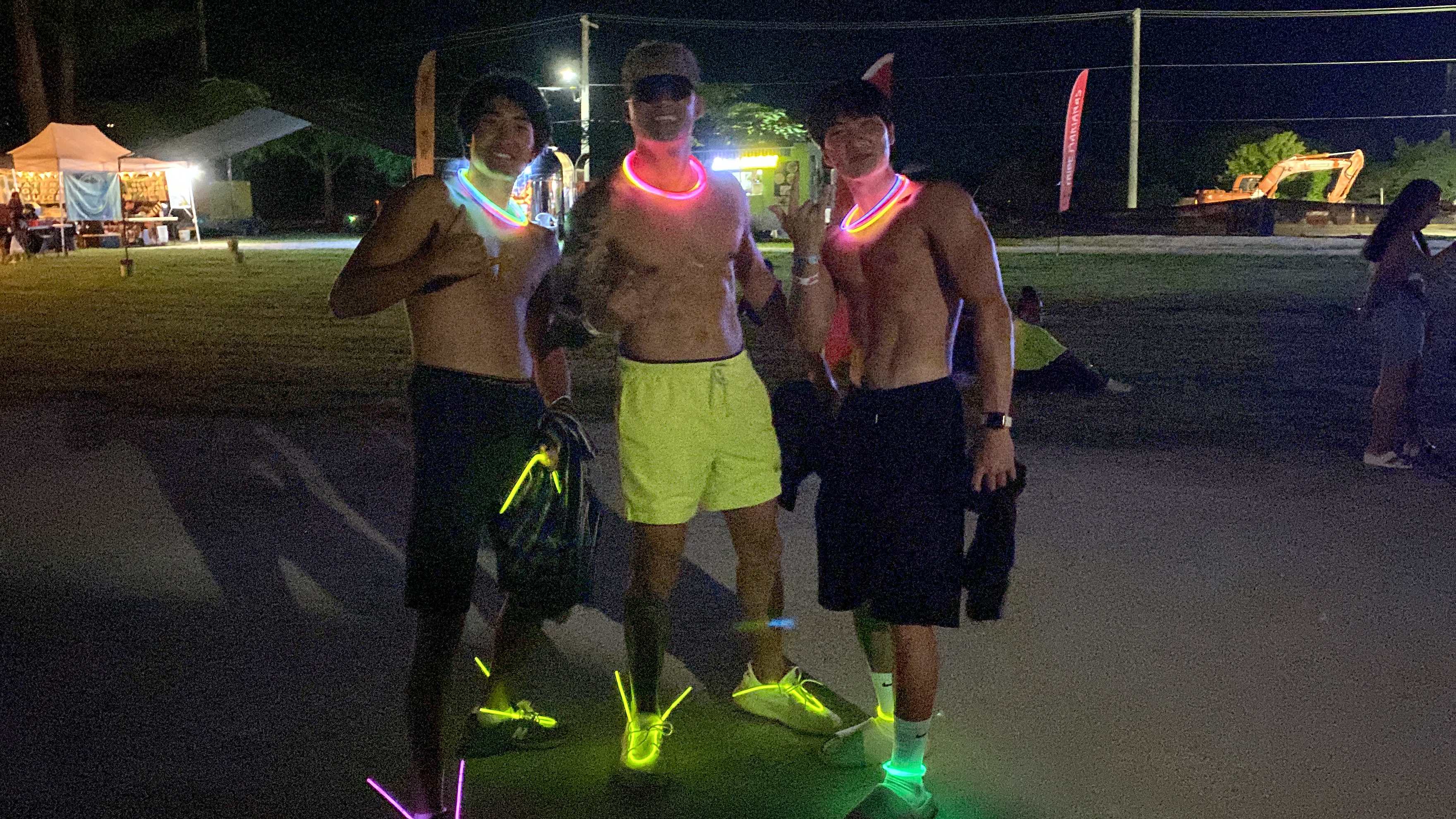 Sun down and it's shirts off for Justin Moon, left, Thomas Reyes, center, and Edward Ham, right. 