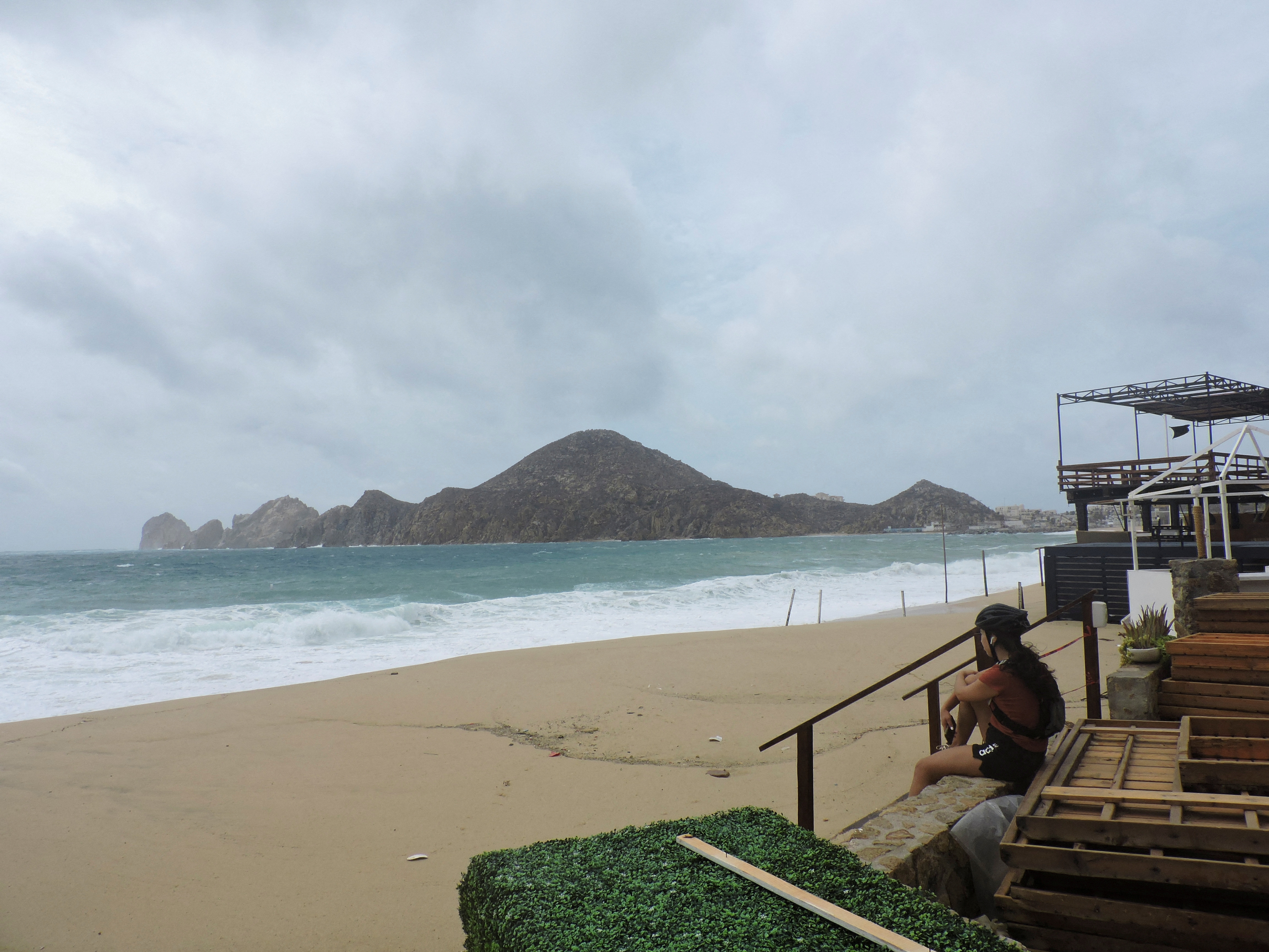 A woman looks on at El Medano beach, as Hurricane Hilary hits Mexico's Baja California peninsula, in Cabo San Lucas, Mexico August 19, 2023. REUTERS/Monserrat Zavala