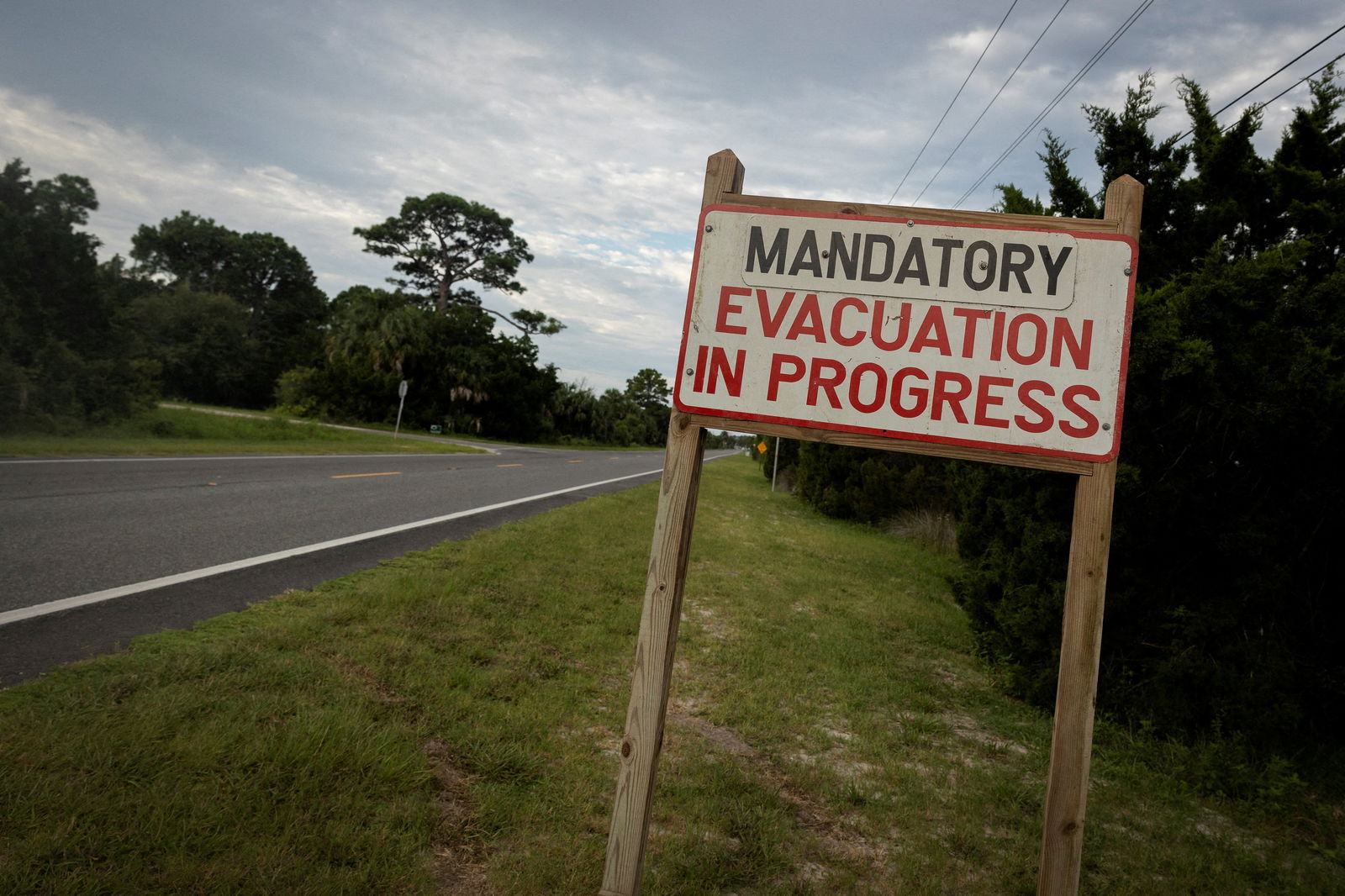 A mandatory evacuation sign is seen ahead of the arrival of Hurricane Idalia, in Cedar Key, Florida, U.S., August 29, 2023. REUTERS/Marco Bello/File Photo